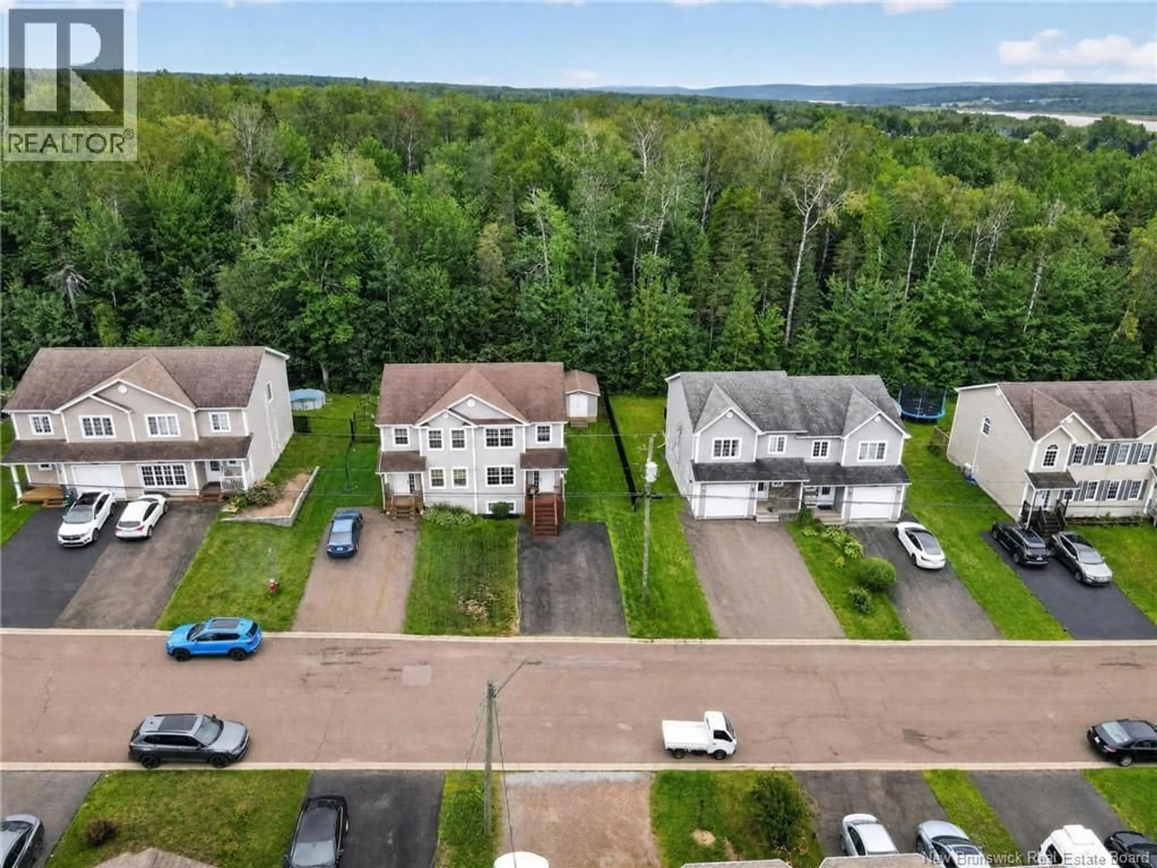 A pic from outside/outdoor area/front of a property/back of a property/a pic from drone, street for 87 DES ERABLES, Dieppe New Brunswick E1A9B1