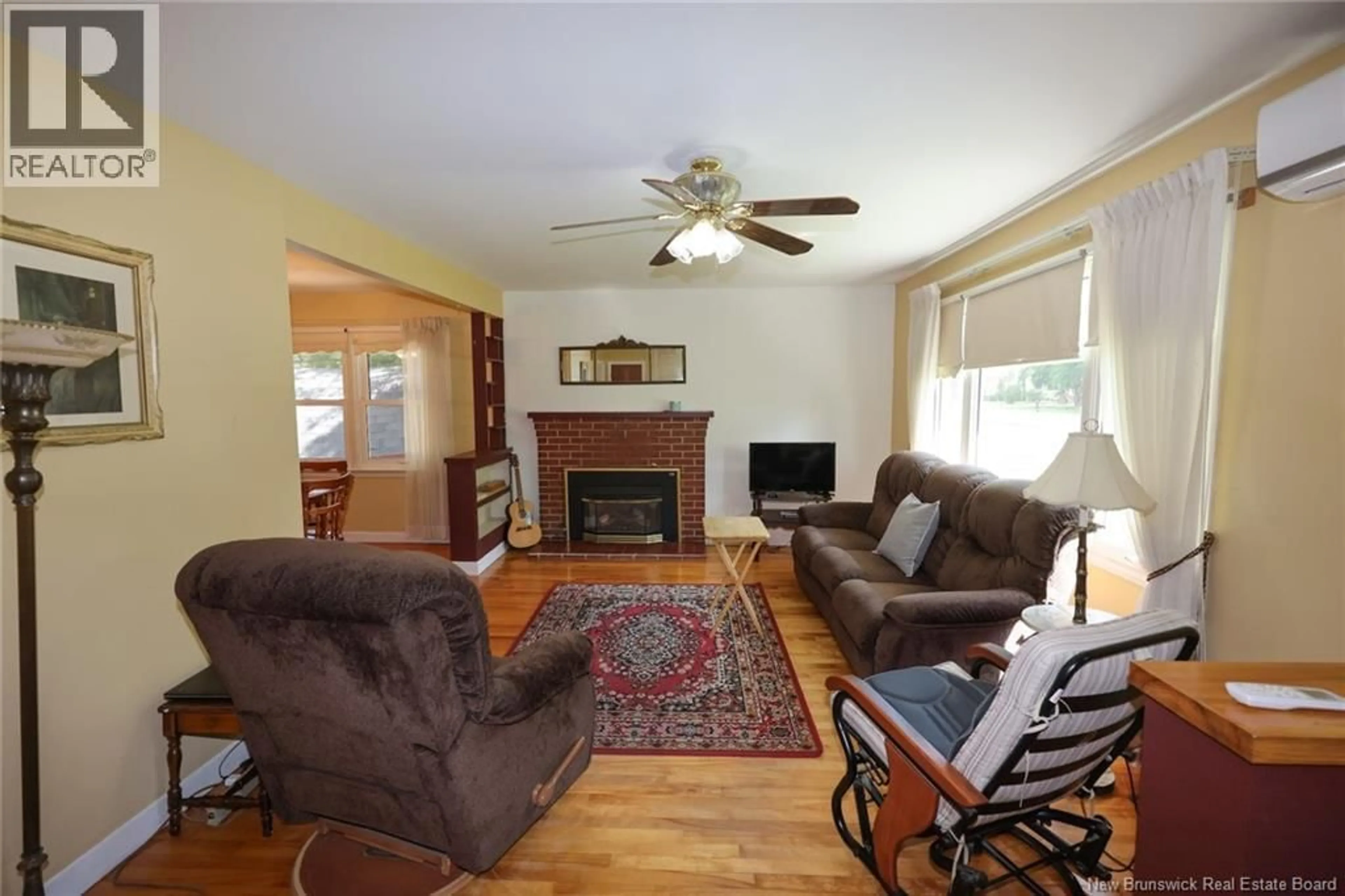 Living room with furniture, wood/laminate floor for 229 FULTON AVENUE, Fredericton New Brunswick E3A2B7