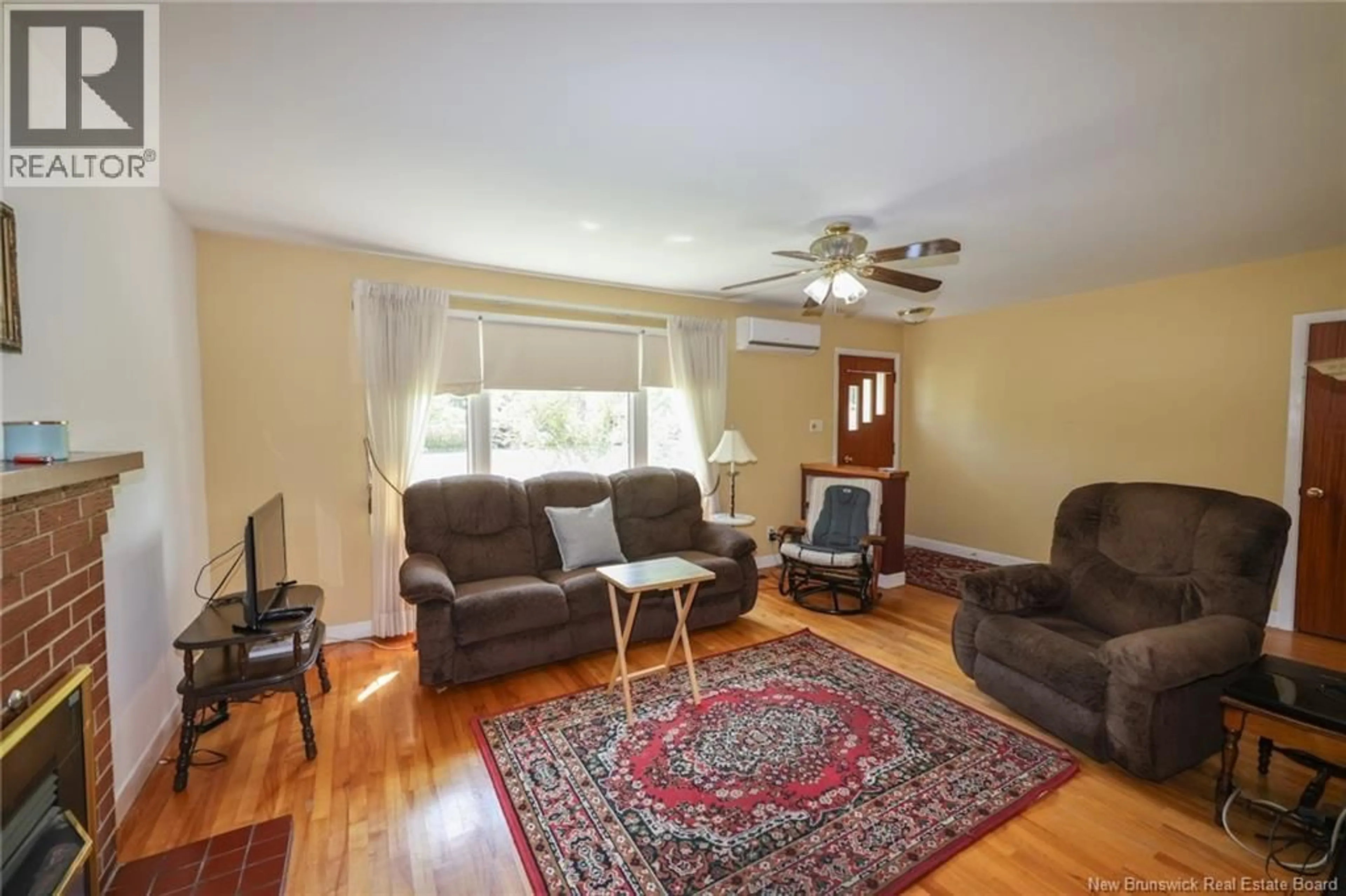 Living room with furniture, wood/laminate floor for 229 FULTON AVENUE, Fredericton New Brunswick E3A2B7