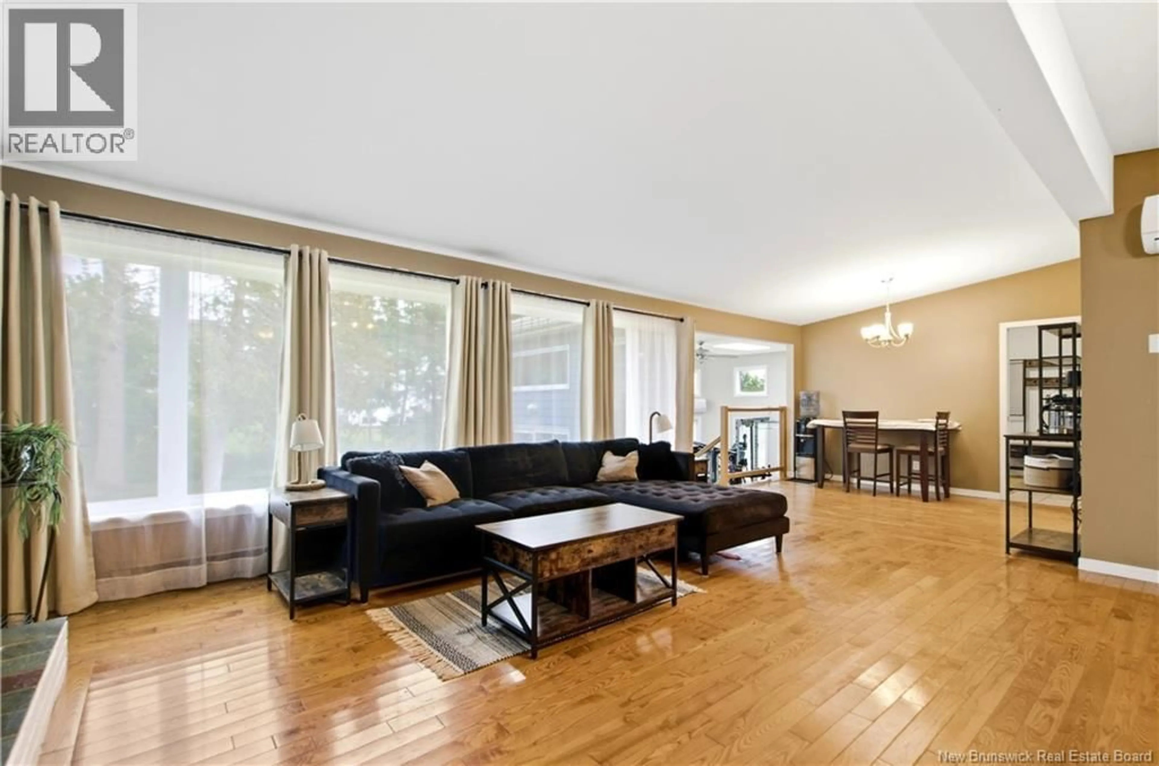 Living room with furniture, wood/laminate floor for 121 PHILLIPS DRIVE, New Maryland New Brunswick E3C1E6
