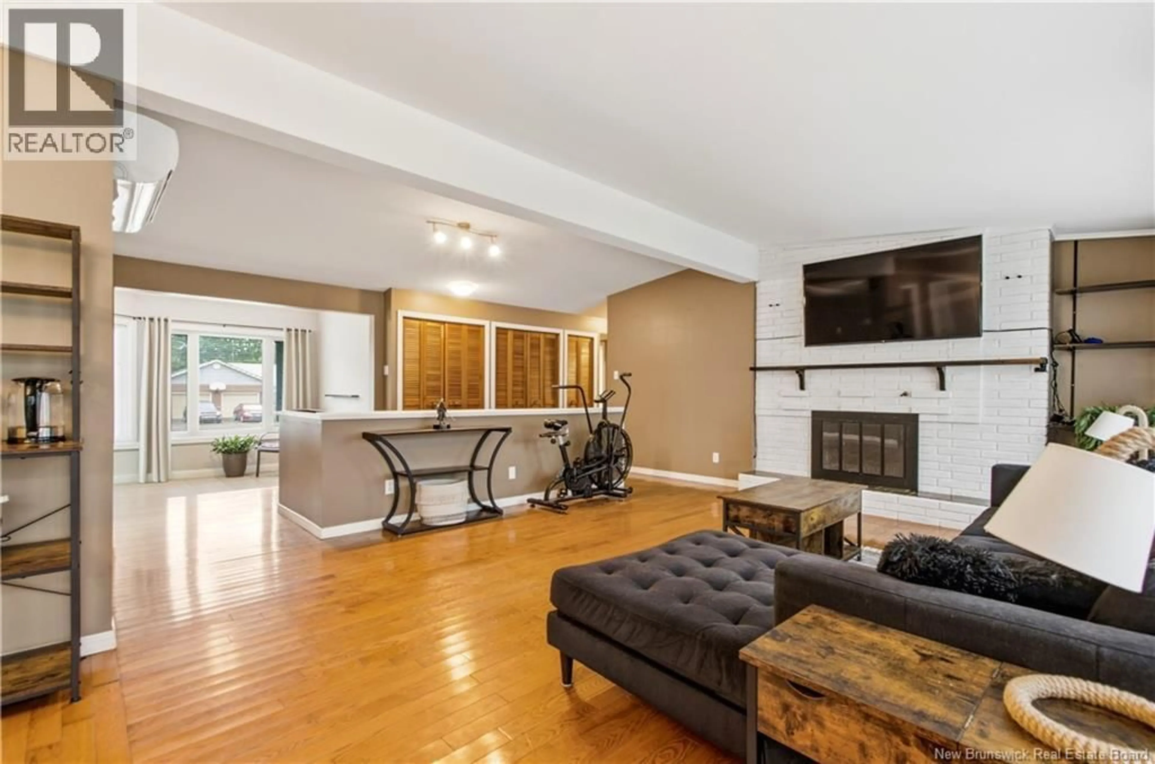 Living room with furniture, wood/laminate floor for 121 PHILLIPS DRIVE, New Maryland New Brunswick E3C1E6