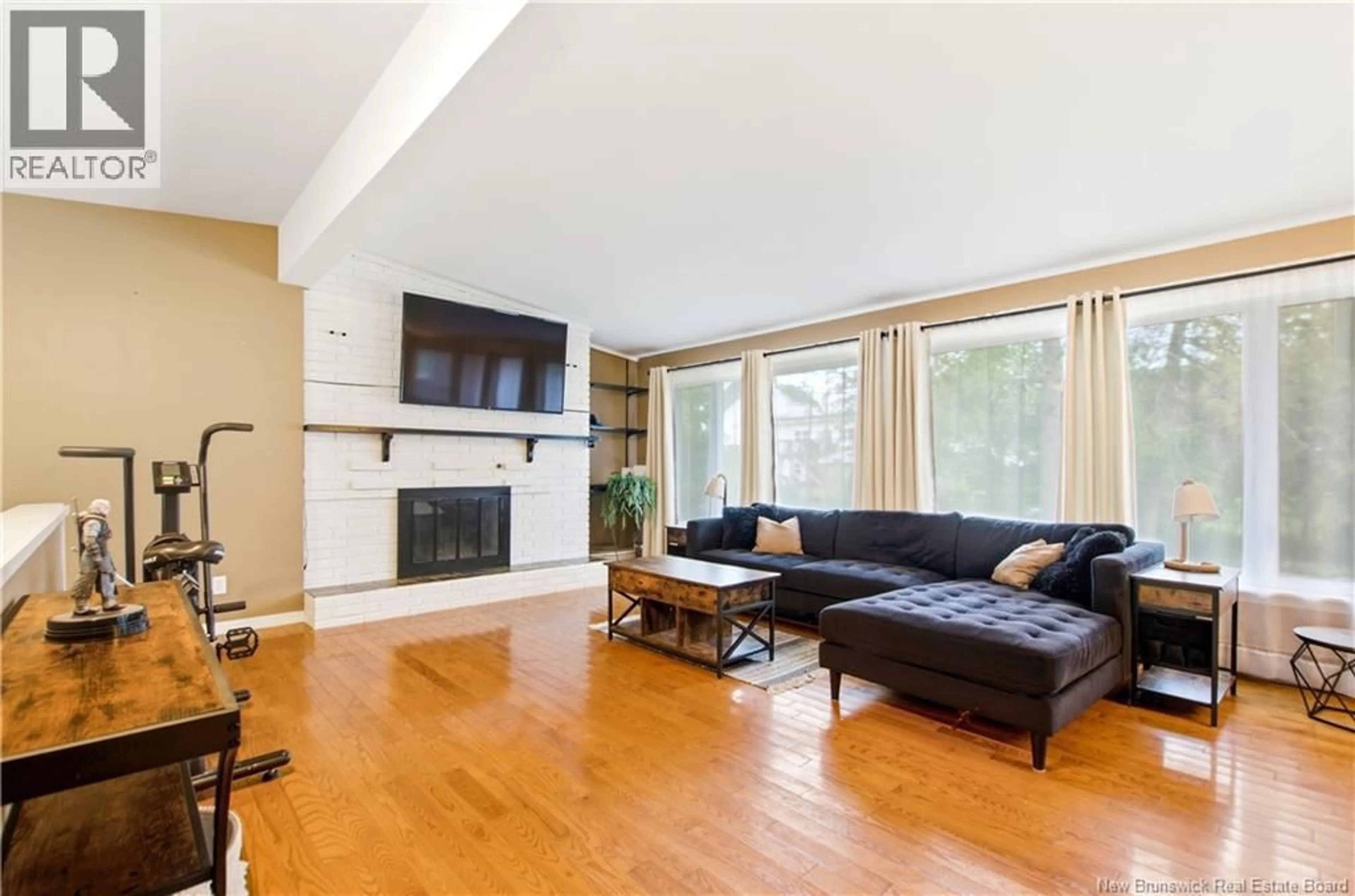 Living room with furniture, wood/laminate floor for 121 PHILLIPS DRIVE, New Maryland New Brunswick E3C1E6