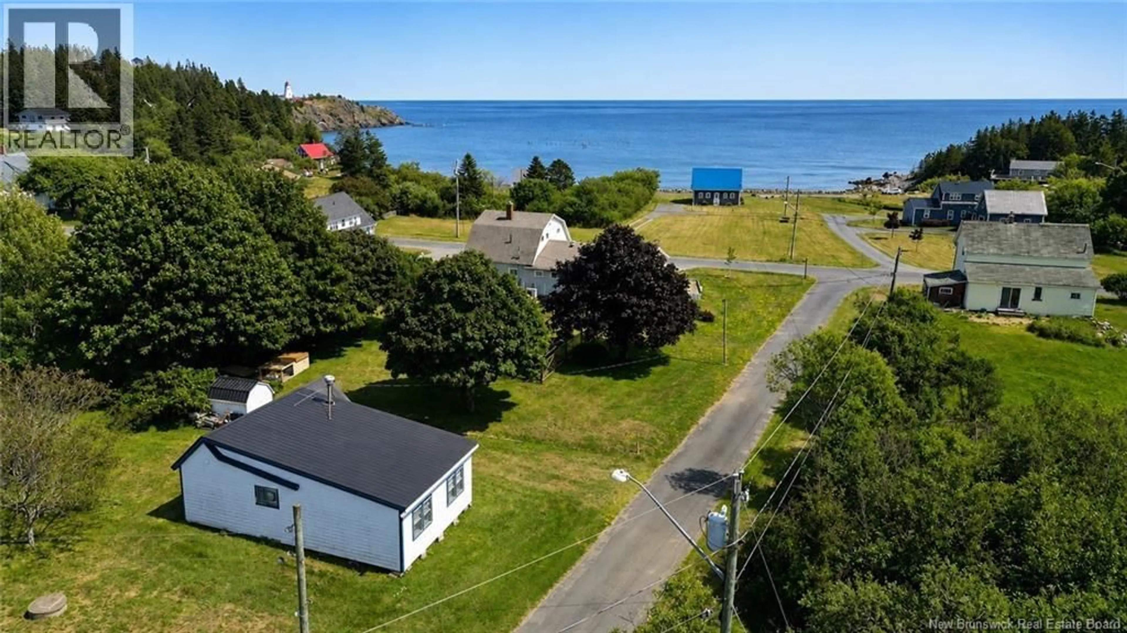 A pic from outside/outdoor area/front of a property/back of a property/a pic from drone, water/lake/river/ocean view for 6 FERN STREET, Grand Manan New Brunswick E5G2A6