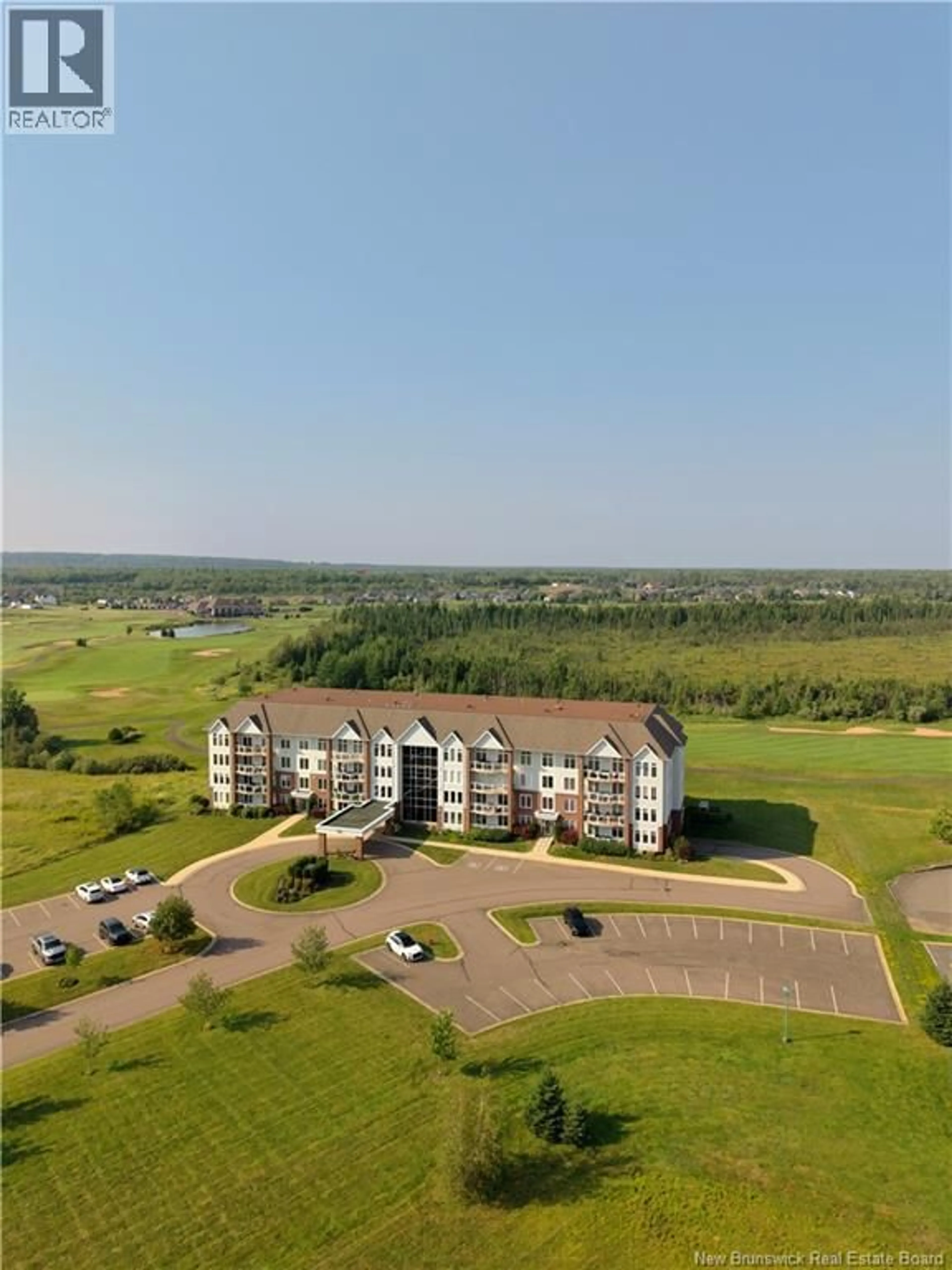 A pic from outside/outdoor area/front of a property/back of a property/a pic from drone, water/lake/river/ocean view for 204 - 185 ROYAL OAKS BOULEVARD, Moncton New Brunswick E1H2P7