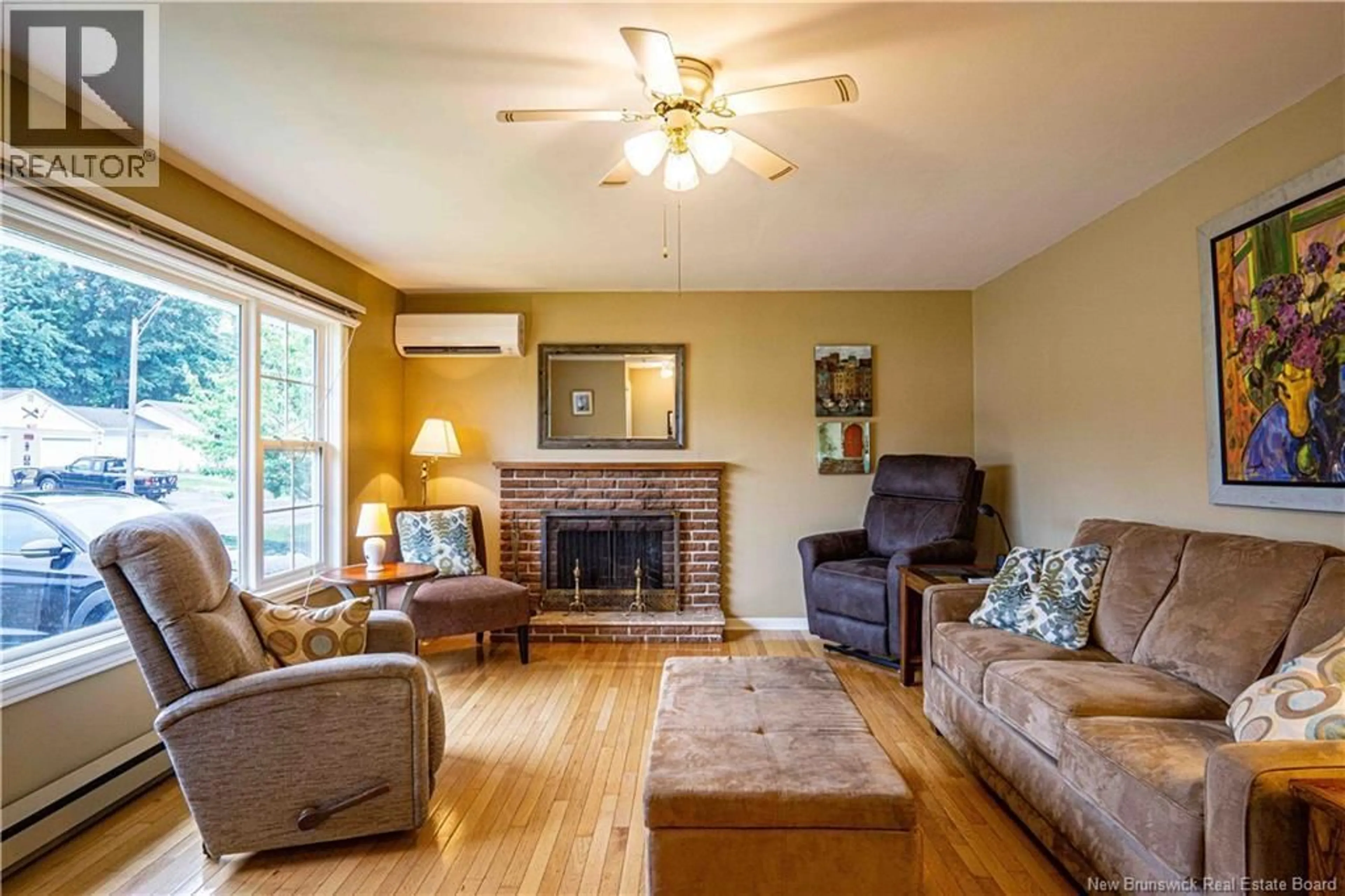 Living room with furniture, wood/laminate floor for 510 GARDINER STREET, Oromocto New Brunswick E2V1G3