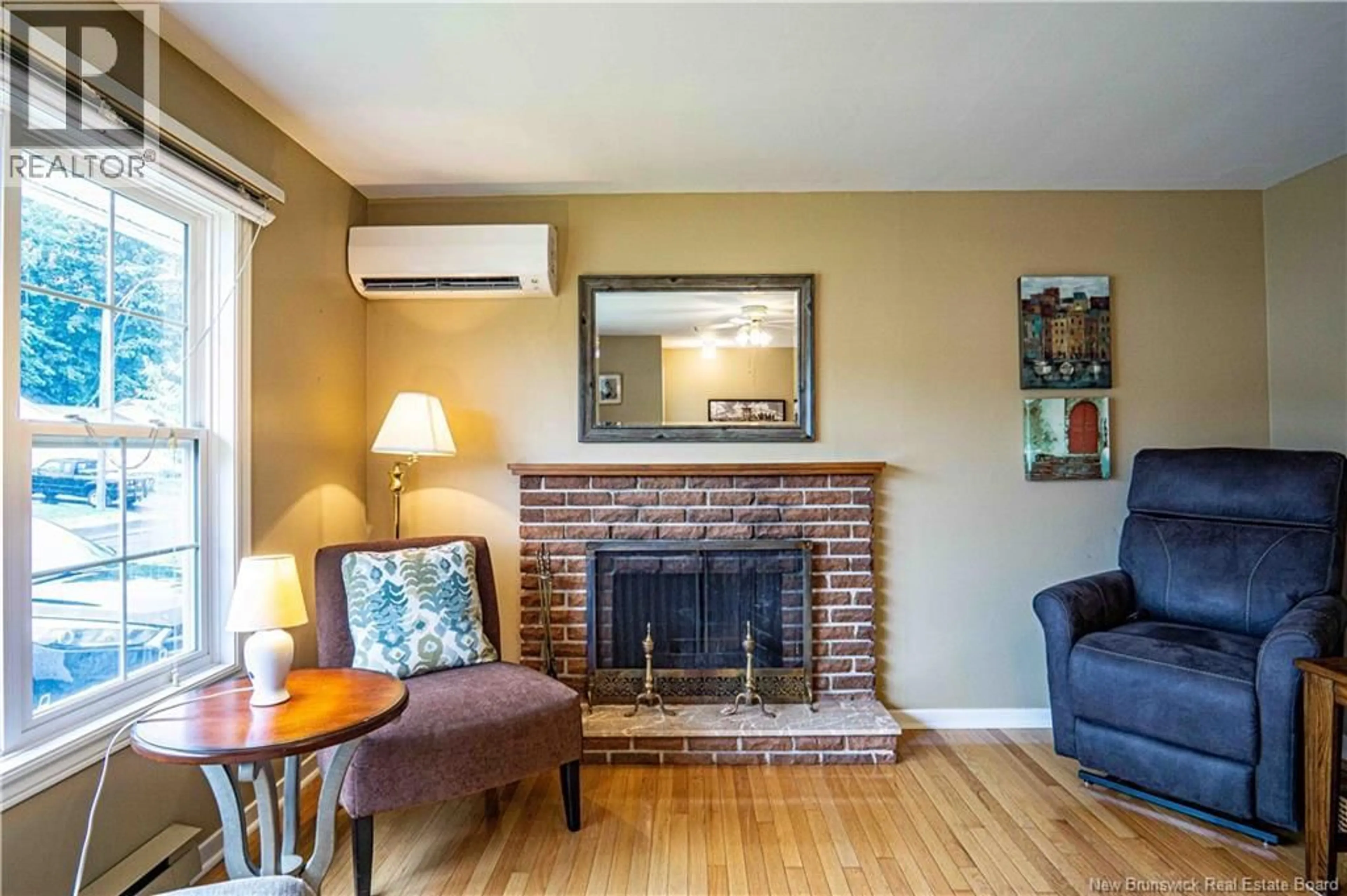 Living room with furniture, wood/laminate floor for 510 GARDINER STREET, Oromocto New Brunswick E2V1G3