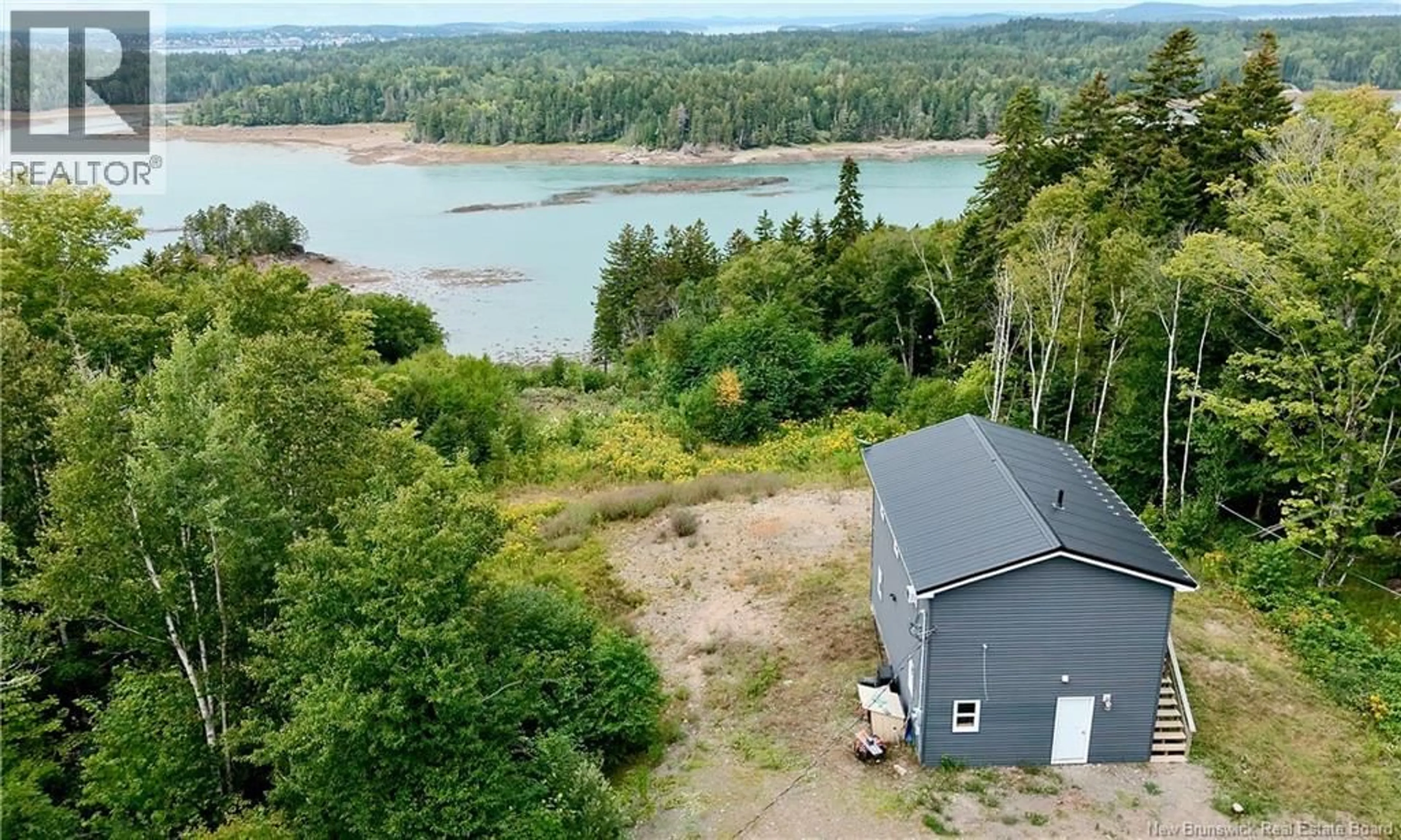 A pic from outside/outdoor area/front of a property/back of a property/a pic from drone, water/lake/river/ocean view for 5 MAPLE LEAF COURT, Wilsons Beach New Brunswick E5E0A9