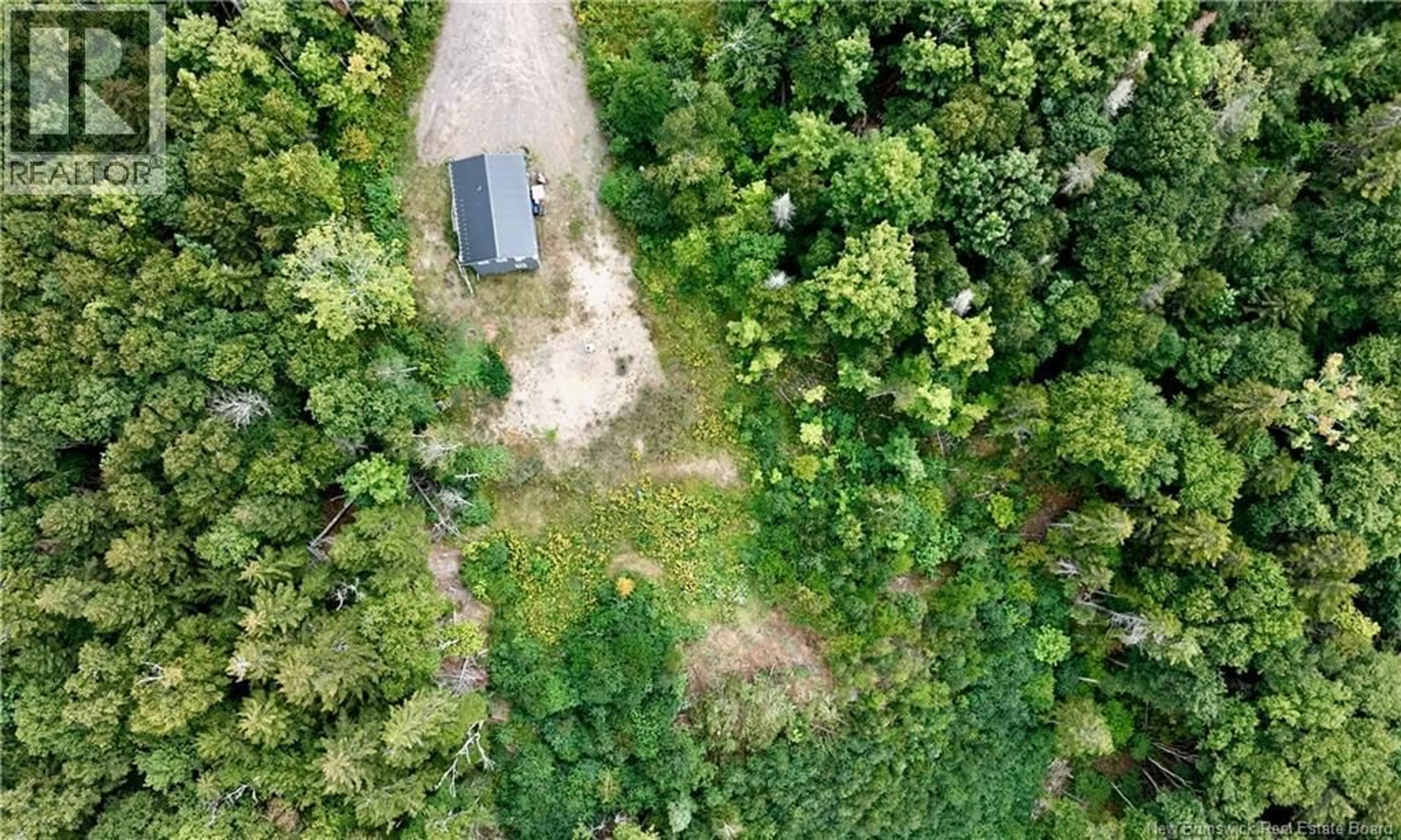 A pic from outside/outdoor area/front of a property/back of a property/a pic from drone, forest/trees view for 5 MAPLE LEAF COURT, Wilsons Beach New Brunswick E5E0A9