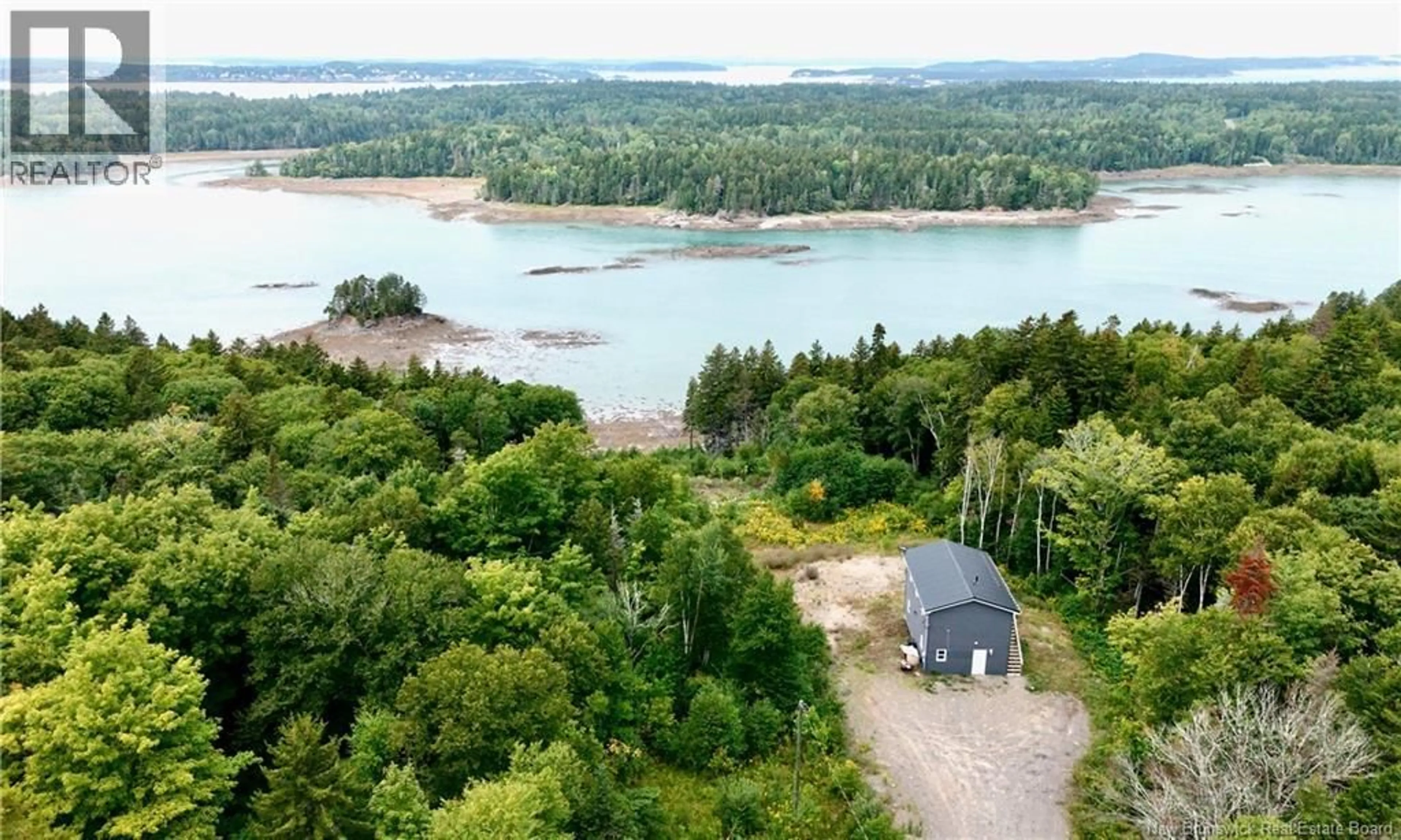 A pic from outside/outdoor area/front of a property/back of a property/a pic from drone, water/lake/river/ocean view for 5 MAPLE LEAF COURT, Wilsons Beach New Brunswick E5E0A9