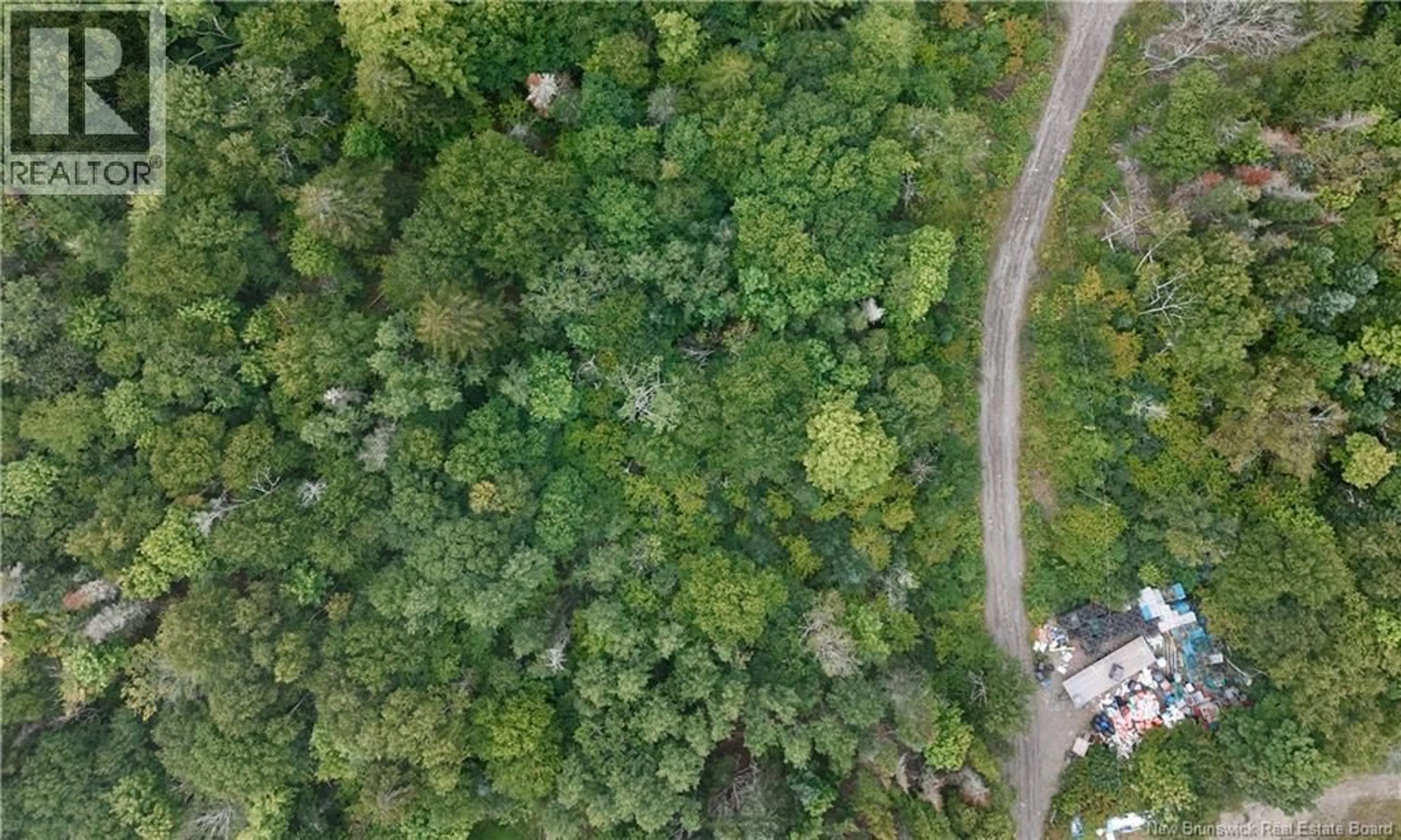 A pic from outside/outdoor area/front of a property/back of a property/a pic from drone, forest/trees view for 5 MAPLE LEAF COURT, Wilsons Beach New Brunswick E5E0A9