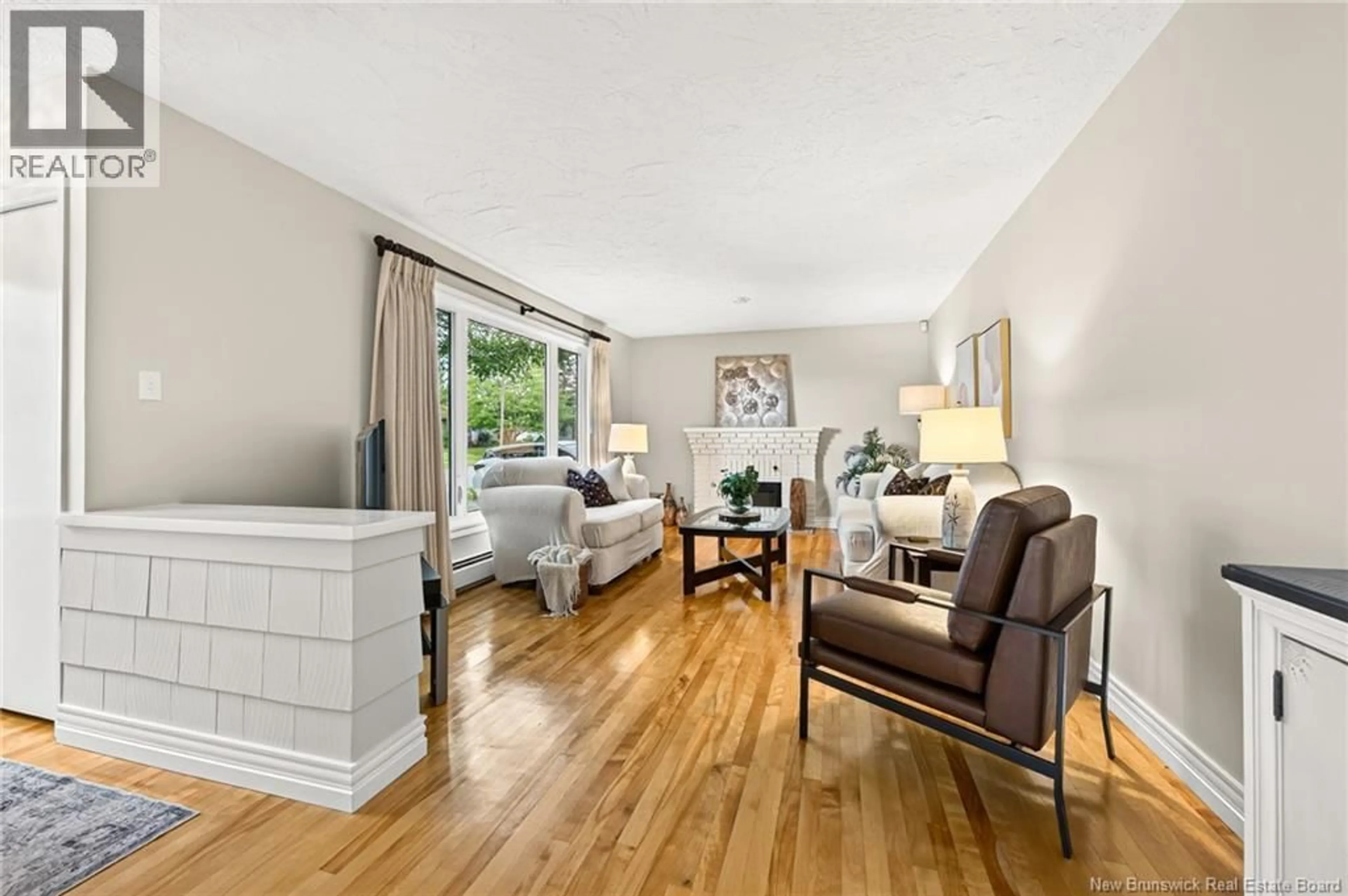 Living room with furniture, wood/laminate floor for 116 ELLERDALE AVENUE, Moncton New Brunswick E1A3N1