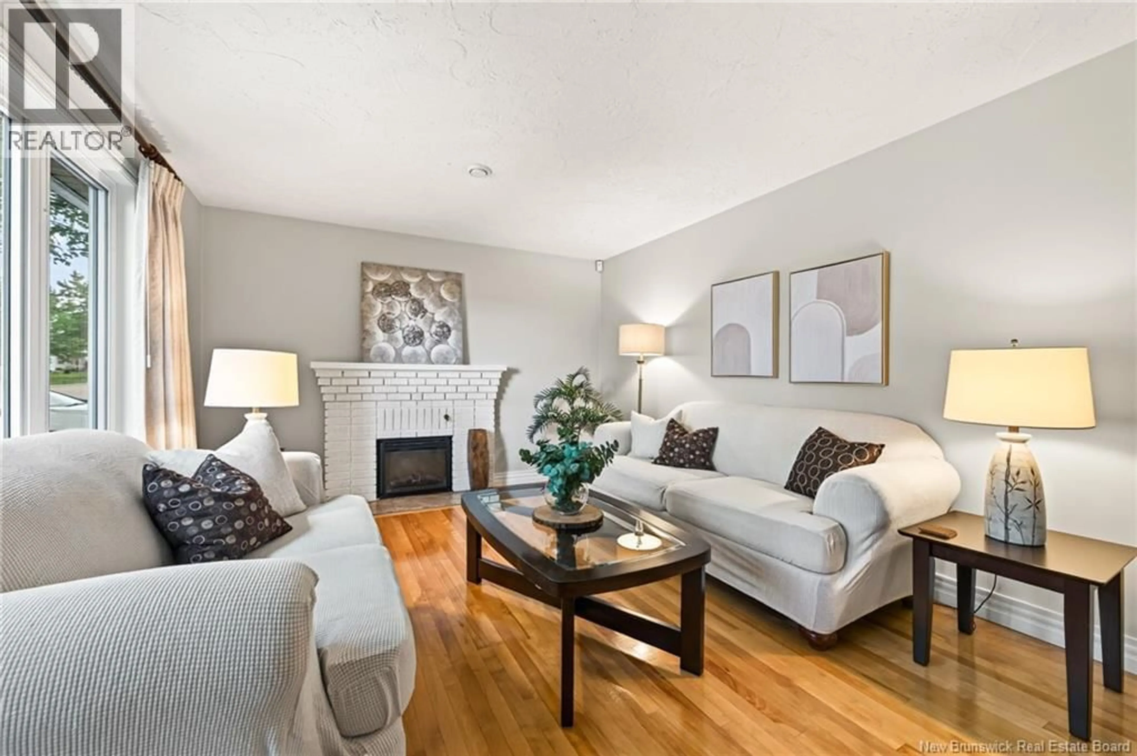 Living room with furniture, wood/laminate floor for 116 ELLERDALE AVENUE, Moncton New Brunswick E1A3N1