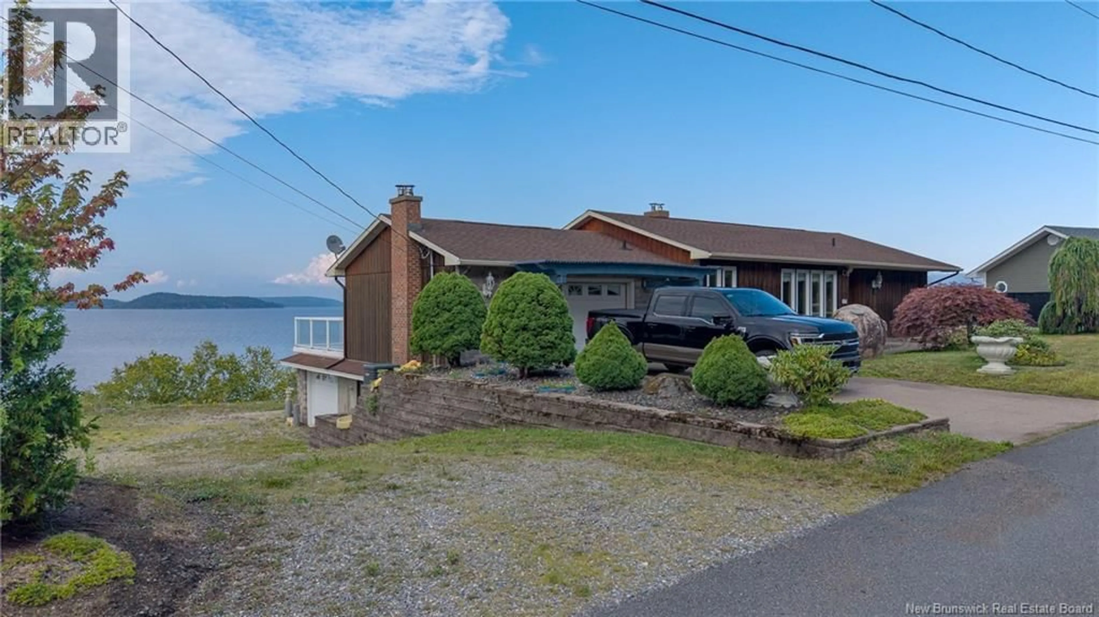 A pic from outside/outdoor area/front of a property/back of a property/a pic from drone, water/lake/river/ocean view for 127 BAY CRESECENT DRIVE, Saint John New Brunswick E2M6M1