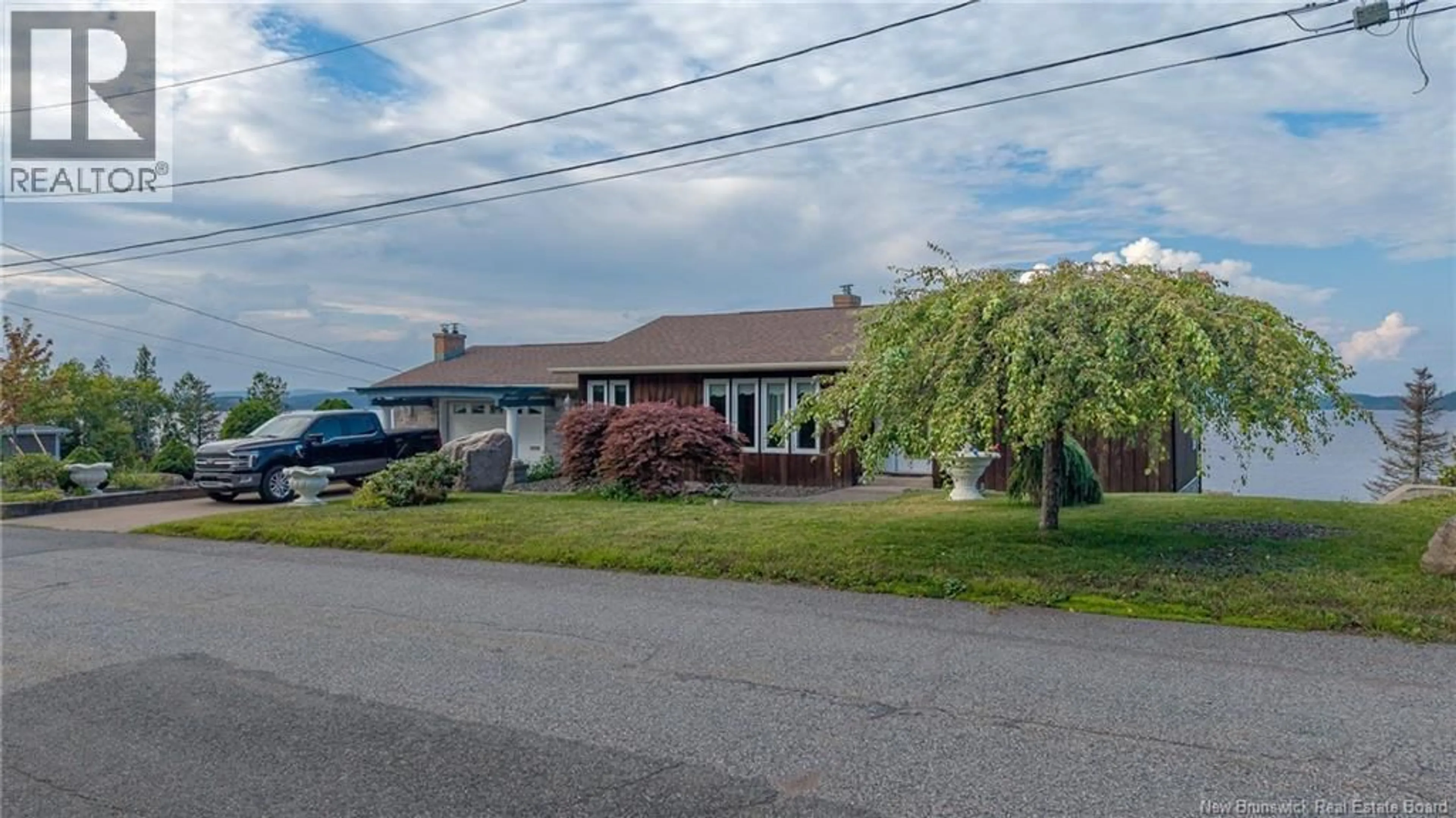 A pic from outside/outdoor area/front of a property/back of a property/a pic from drone, street for 127 BAY CRESECENT DRIVE, Saint John New Brunswick E2M6M1