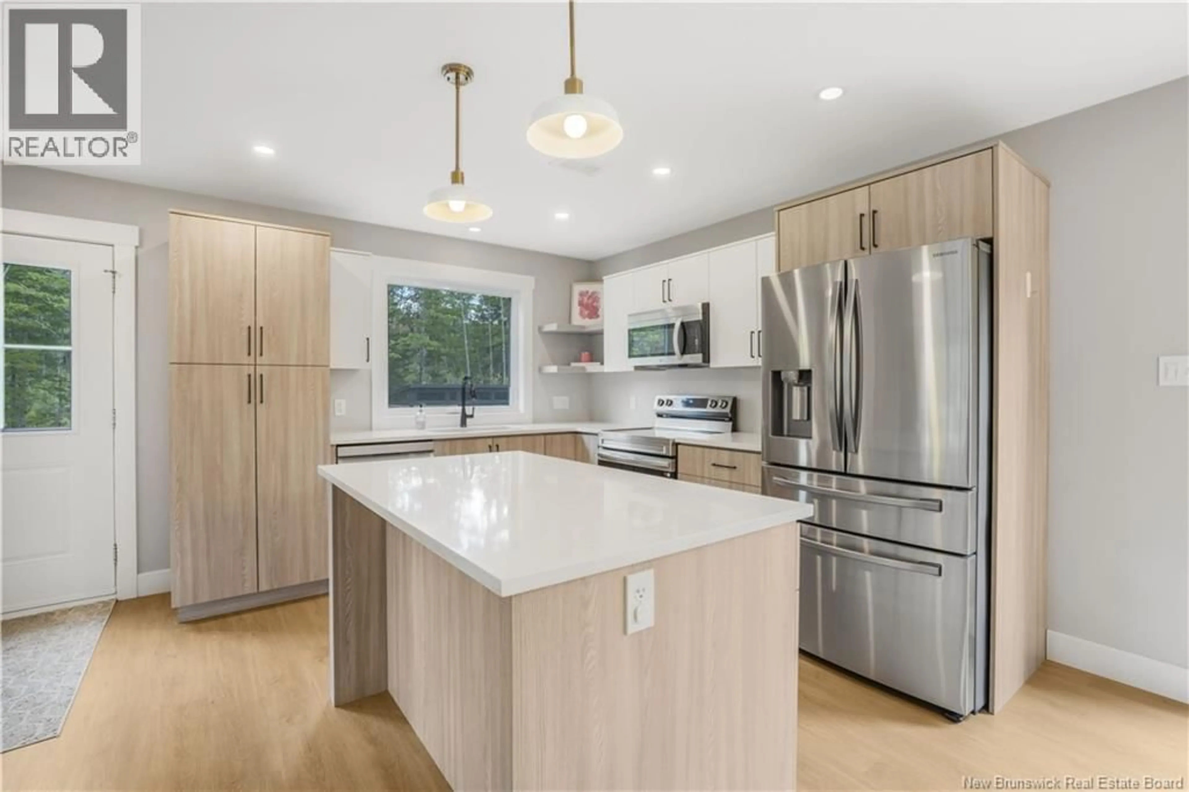 Open concept kitchen, wood/laminate floor for 9 WAYLON COURT, Rusagonis New Brunswick E3B8Z6