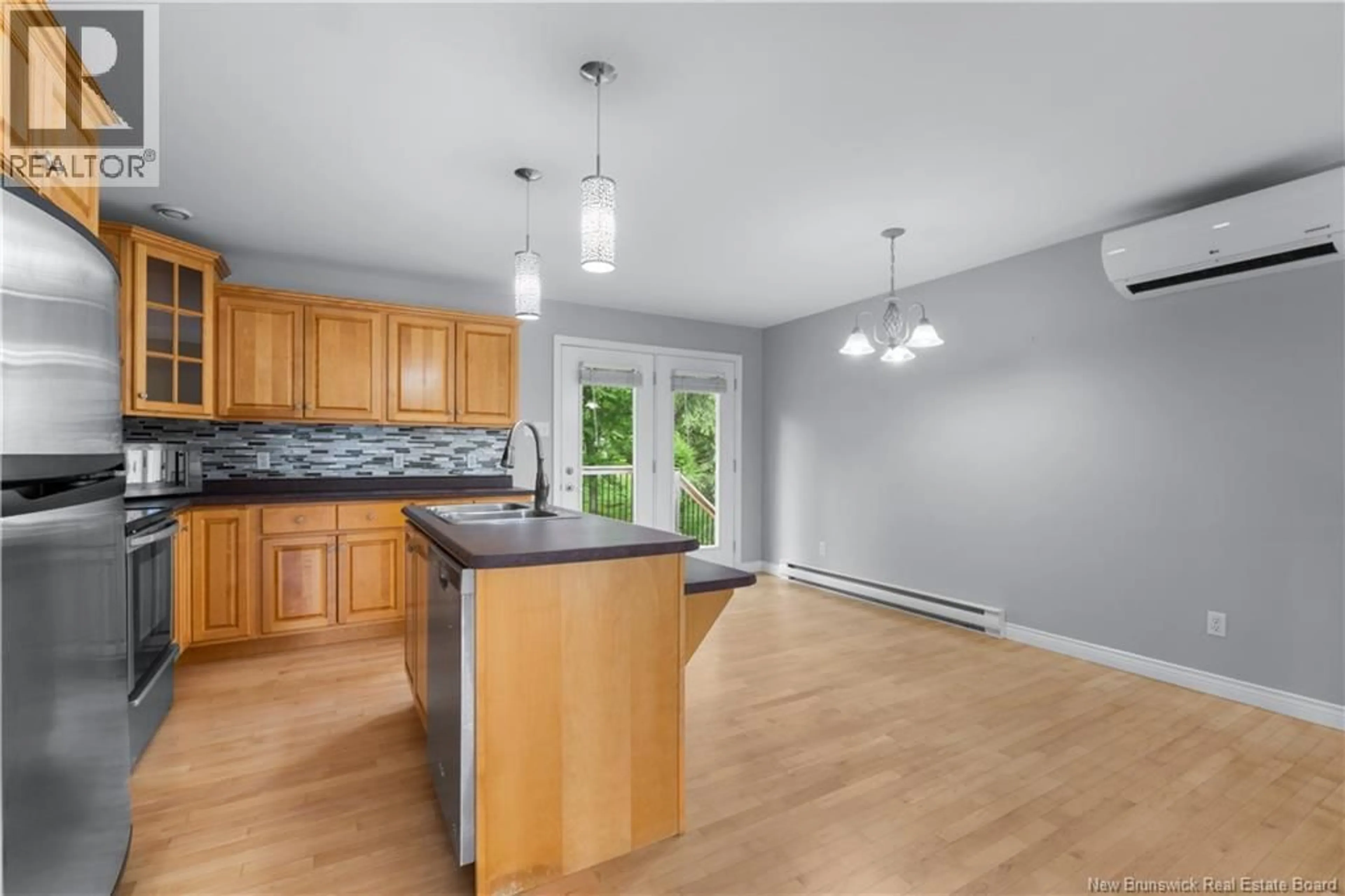 Open concept kitchen, wood/laminate floor for 941 BARACHOIS, Dieppe New Brunswick E1A6X5