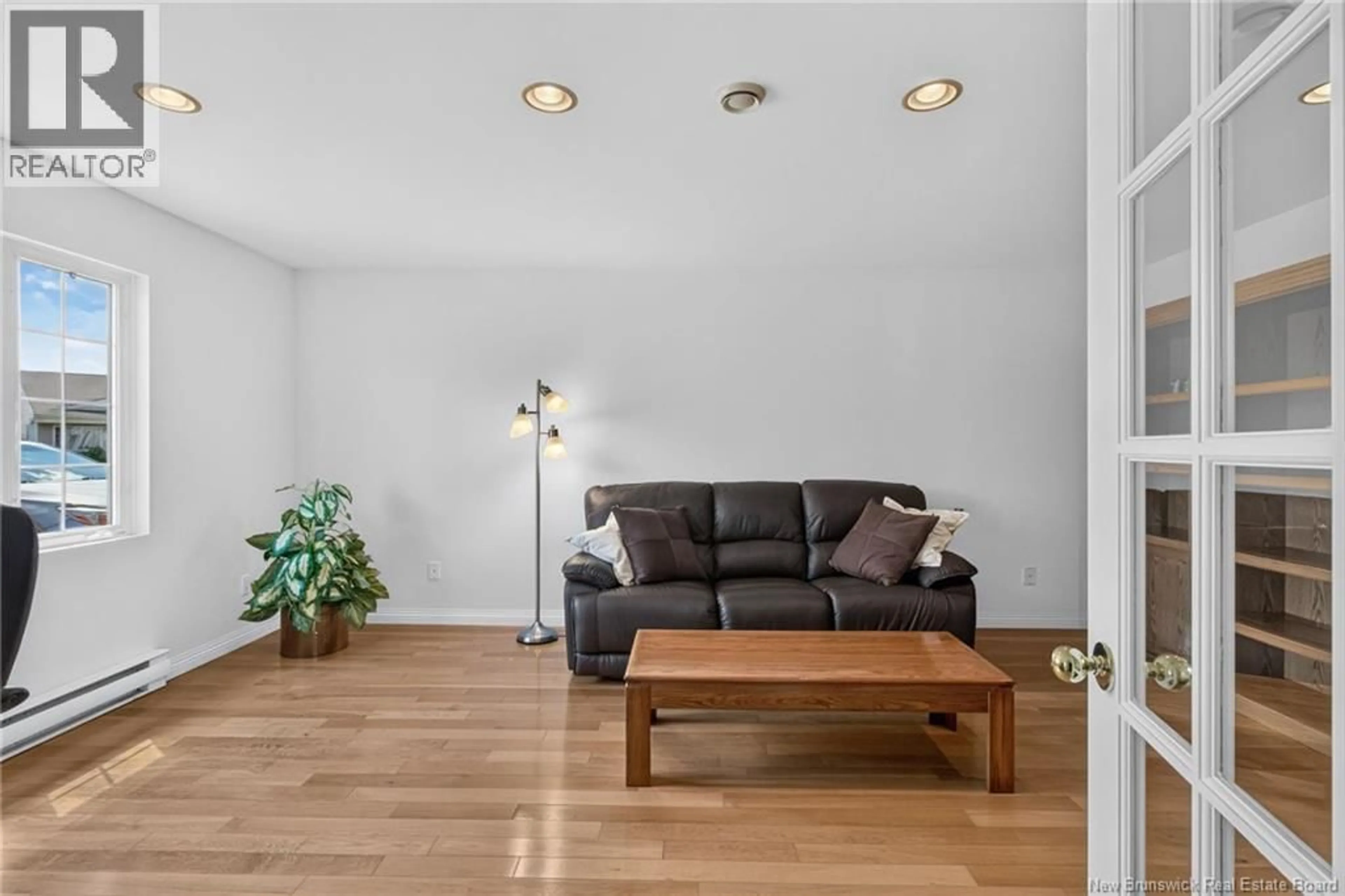 Living room with furniture, wood/laminate floor for 268-180 ACADIE, Dieppe New Brunswick E1A6T2