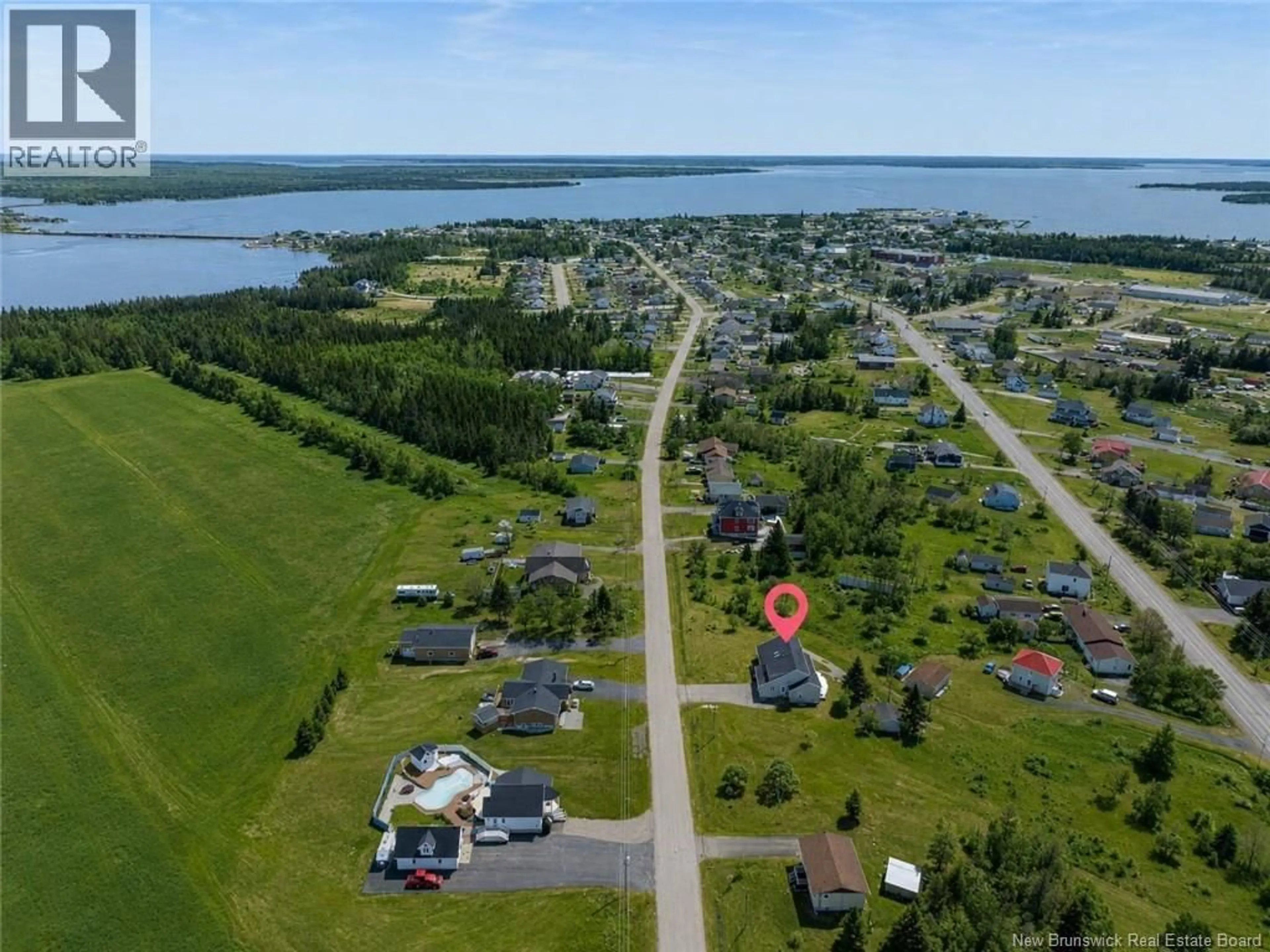 A pic from outside/outdoor area/front of a property/back of a property/a pic from drone, water/lake/river/ocean view for 116 DES CHAMPS STREET, Lamèque New Brunswick E8T1E7