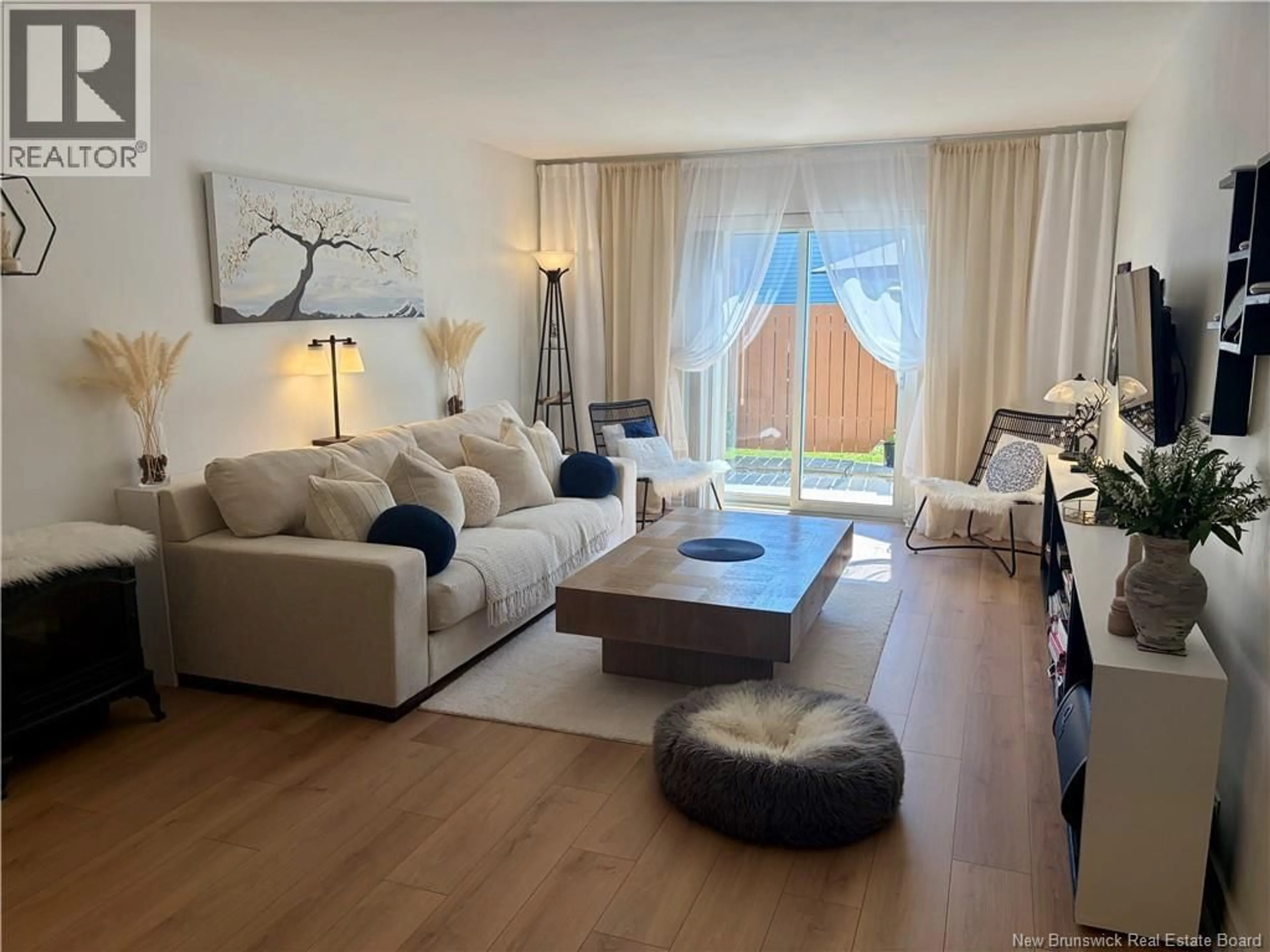 Living room with furniture, wood/laminate floor for 4 - 331 MCLAUGHLIN DRIVE, Moncton New Brunswick E1A4R3