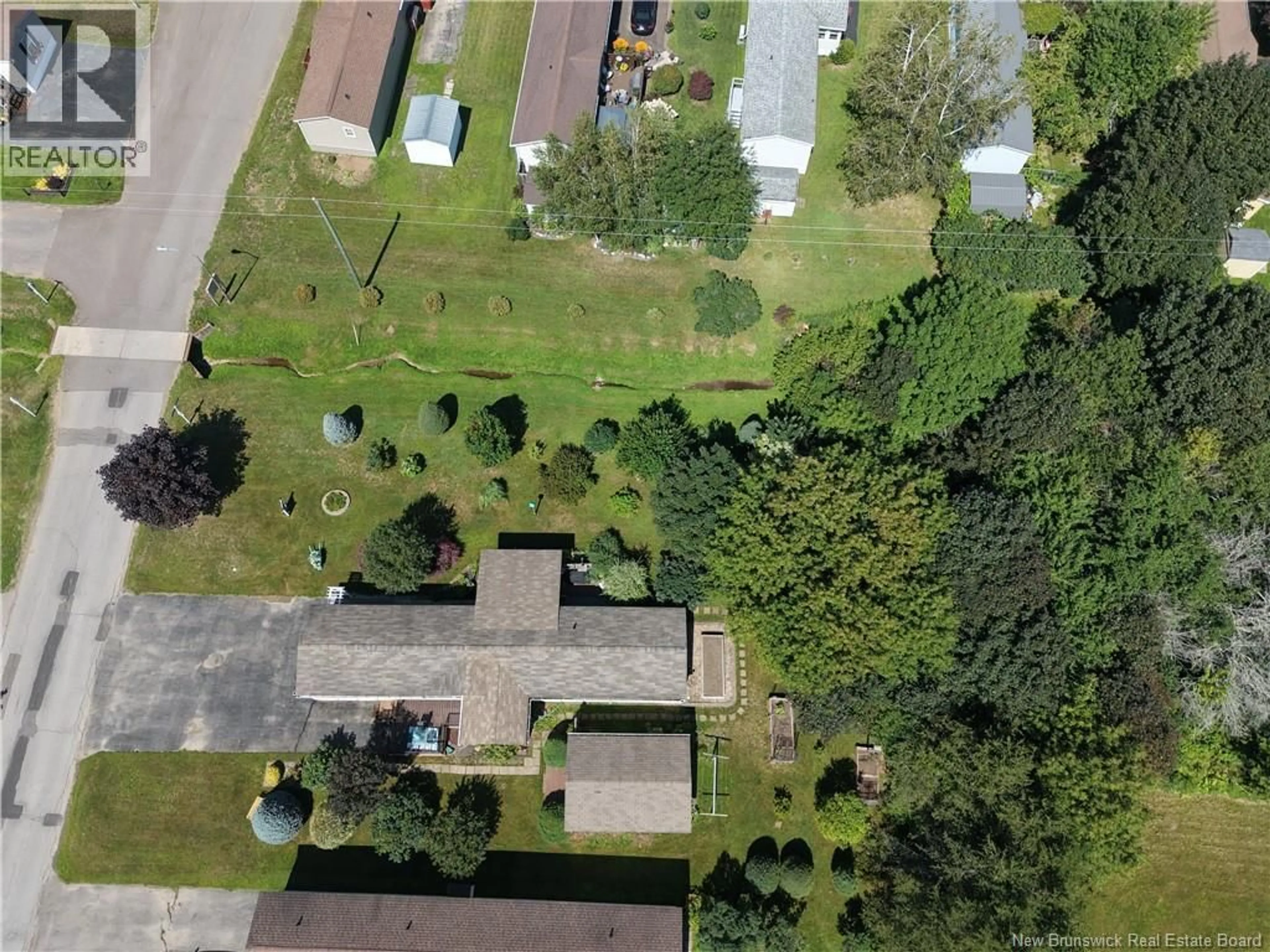 A pic from outside/outdoor area/front of a property/back of a property/a pic from drone, street for 27 PARK AVENUE, Sussex Corner New Brunswick E5T1R6
