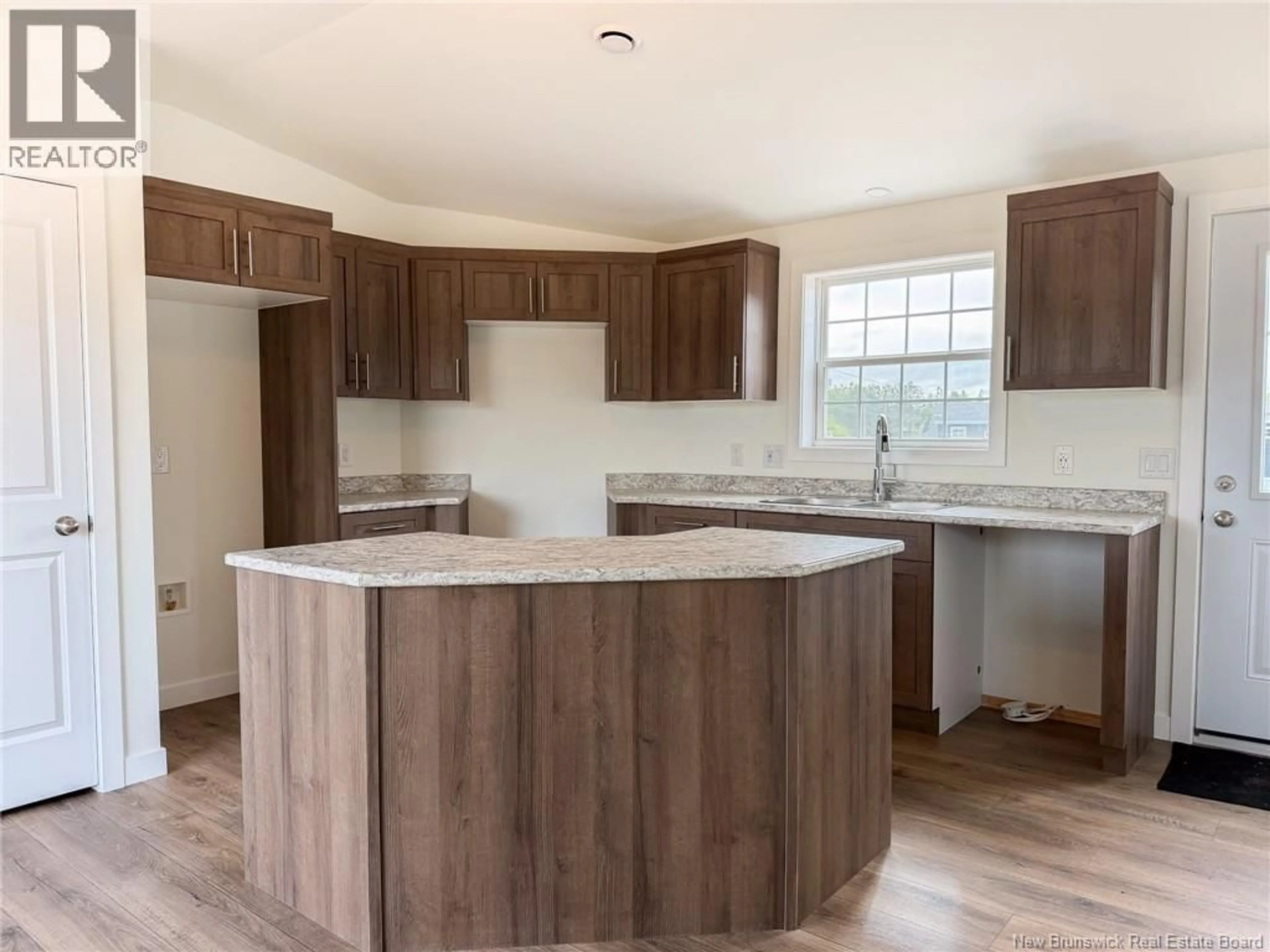 Open concept kitchen, wood/laminate floor for 40 LUANNE DRIVE, Lincoln New Brunswick E3B0Z5