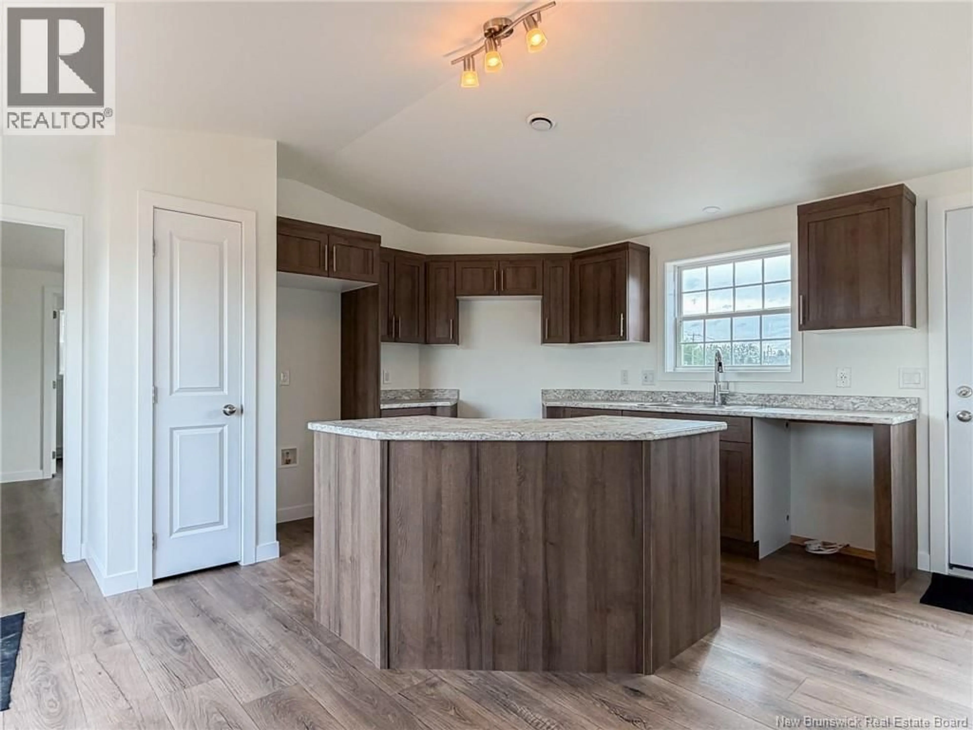 Open concept kitchen, wood/laminate floor for 40 LUANNE DRIVE, Lincoln New Brunswick E3B0Z5