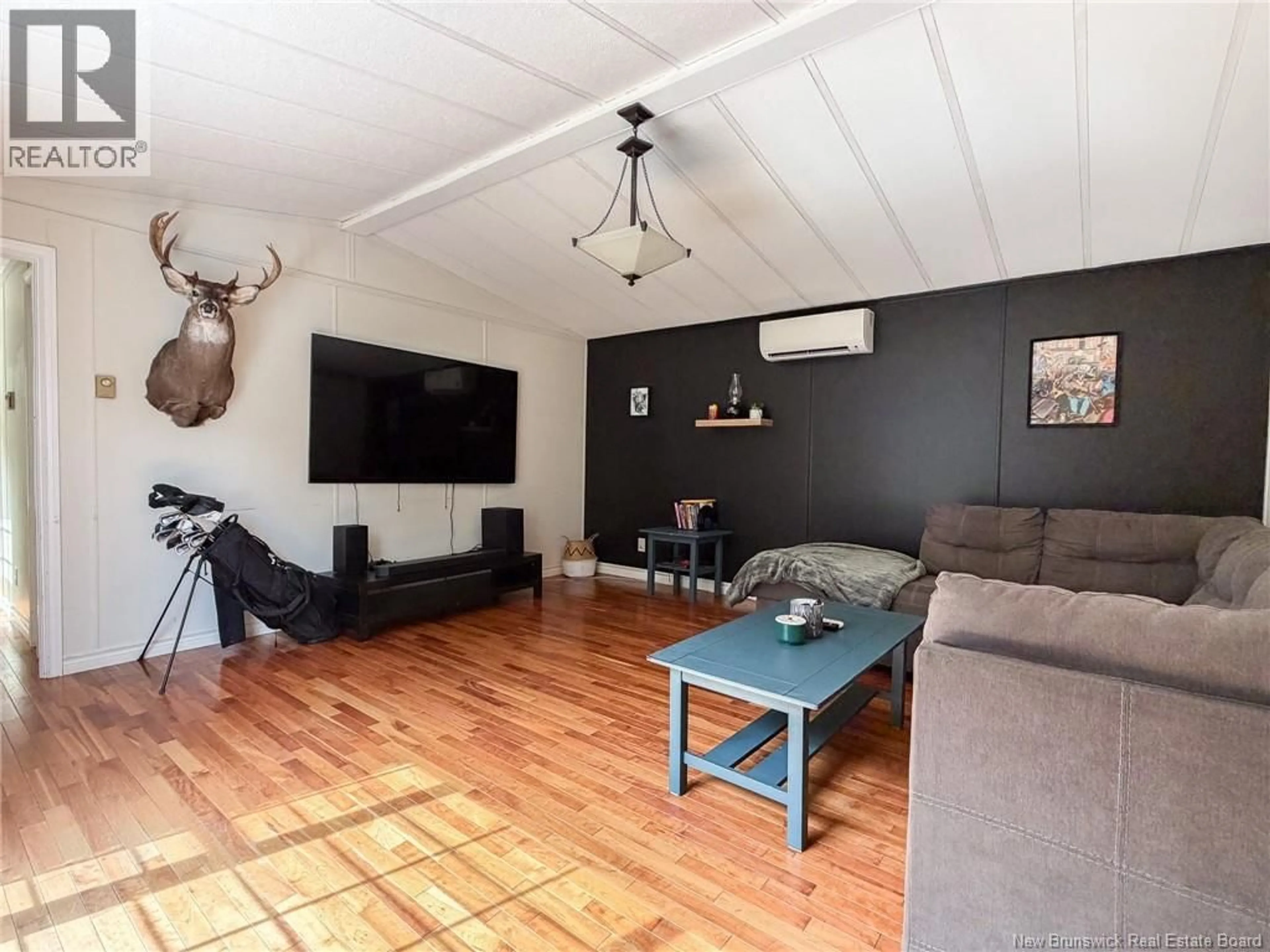 Living room with furniture, wood/laminate floor for 153 MOORE STREET, Fredericton New Brunswick E3B8L8