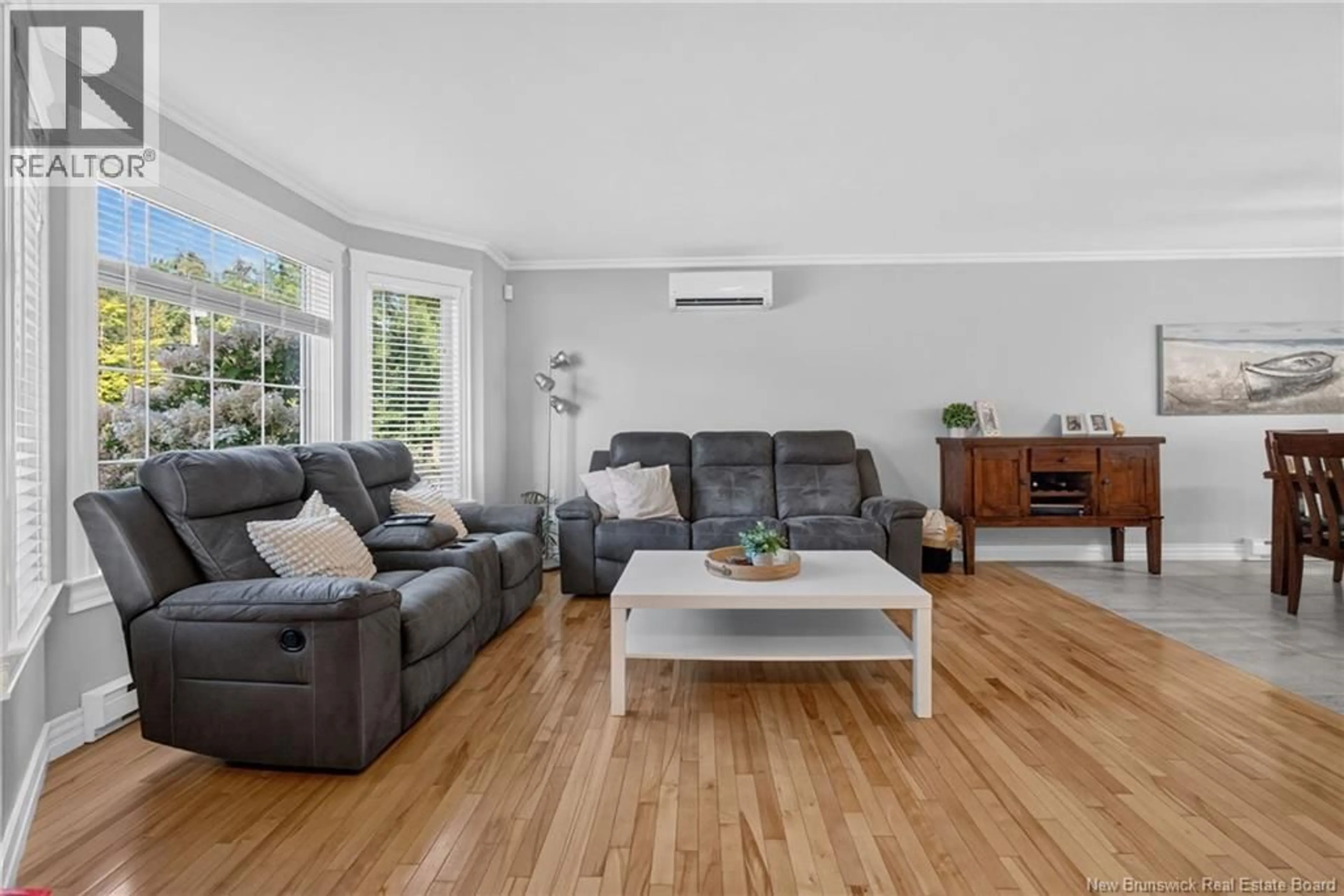 Living room with furniture, wood/laminate floor for 17 ZOEL STREET, Dieppe New Brunswick E1A0E5