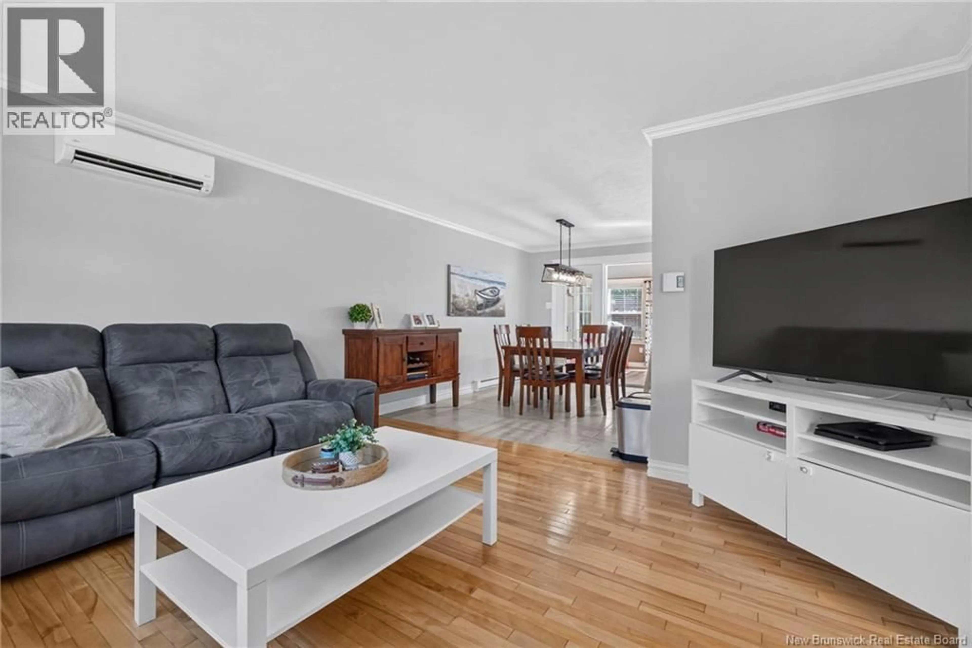 Living room with furniture, wood/laminate floor for 17 ZOEL STREET, Dieppe New Brunswick E1A0E5