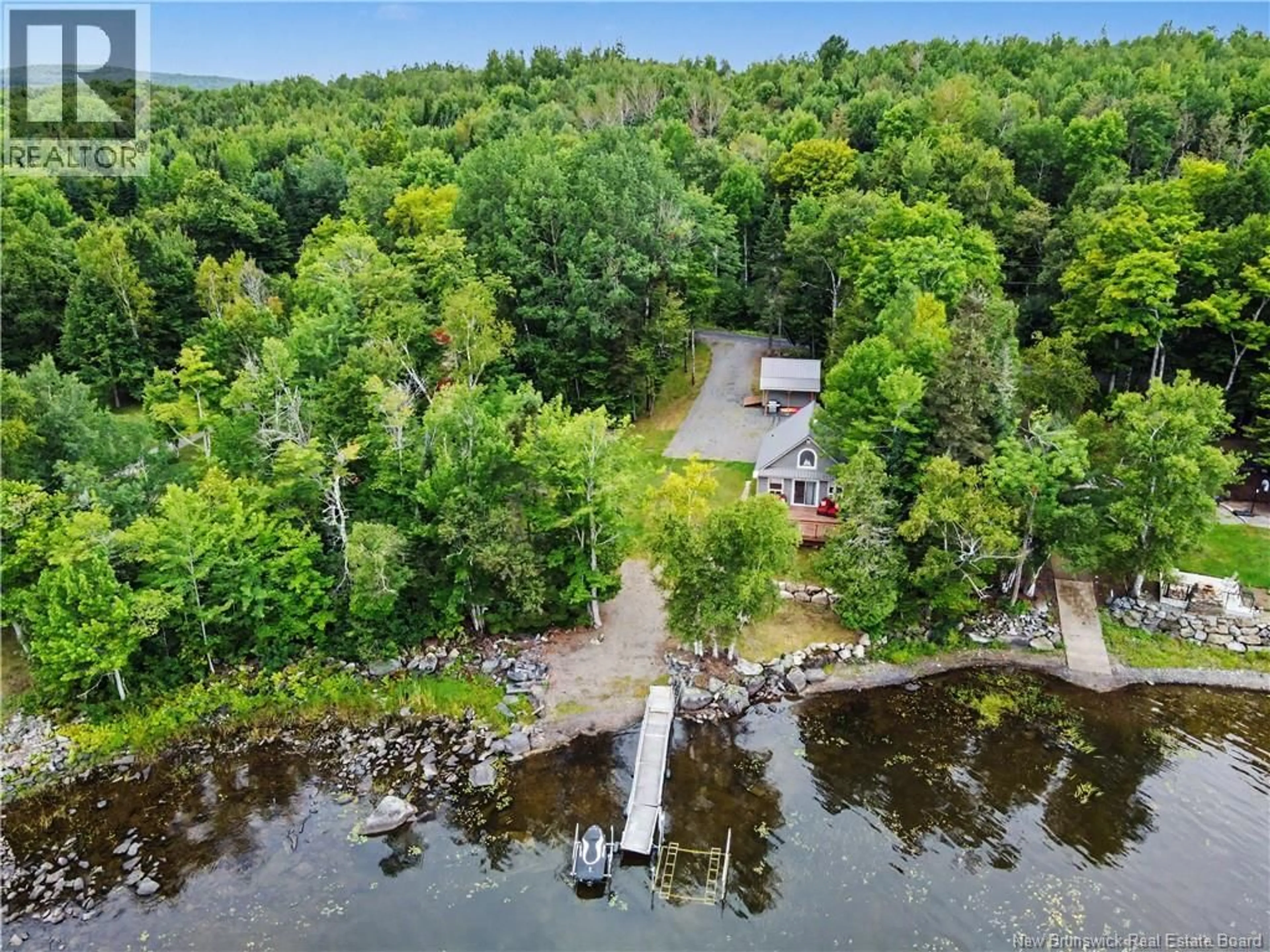 A pic from outside/outdoor area/front of a property/back of a property/a pic from drone, water/lake/river/ocean view for 104 WATSON LANE, First Eel Lake New Brunswick E7N3B5