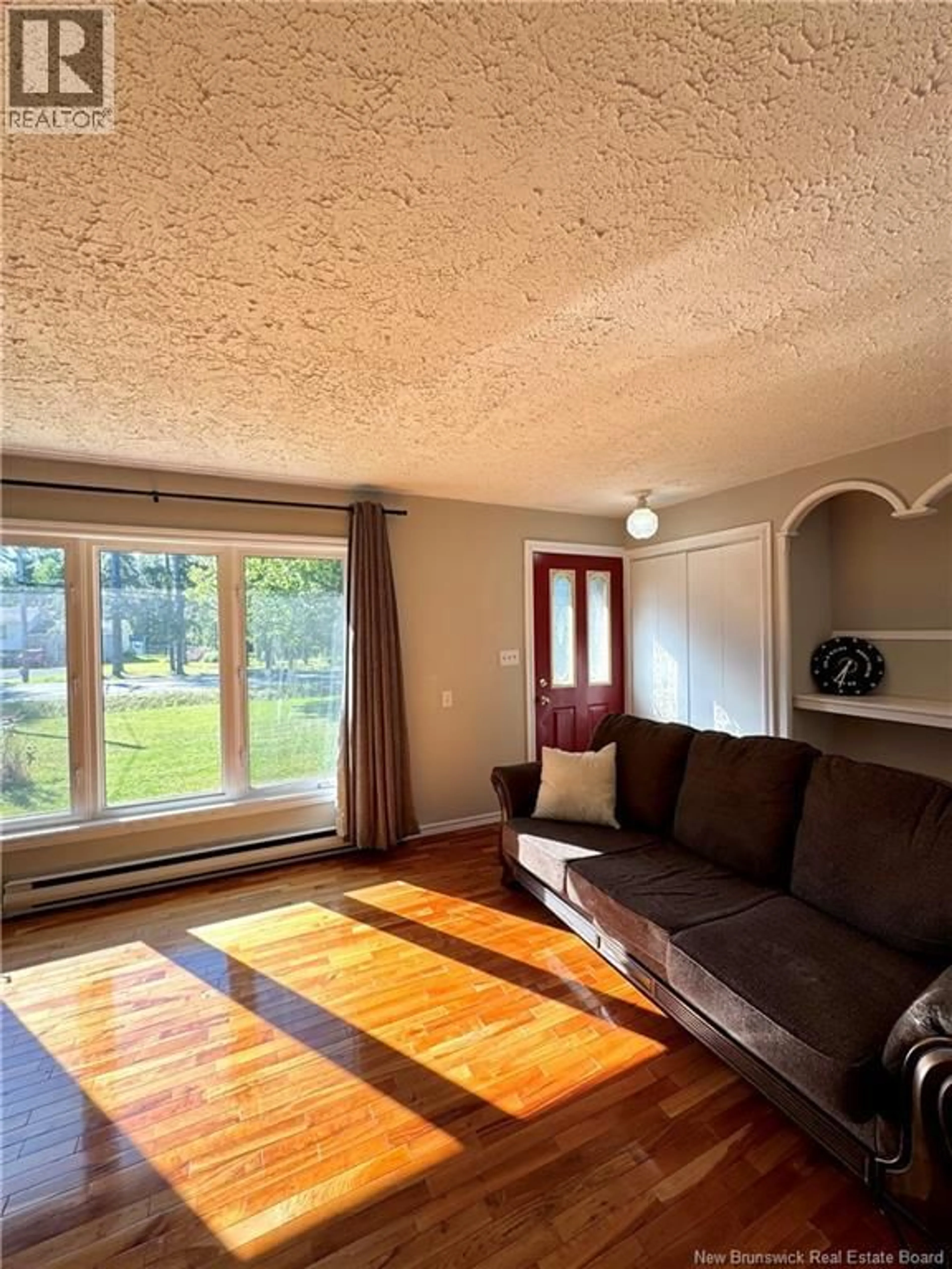 Living room with furniture, wood/laminate floor for 505 WELLINGTON STREET, Miramichi New Brunswick E1N3L3