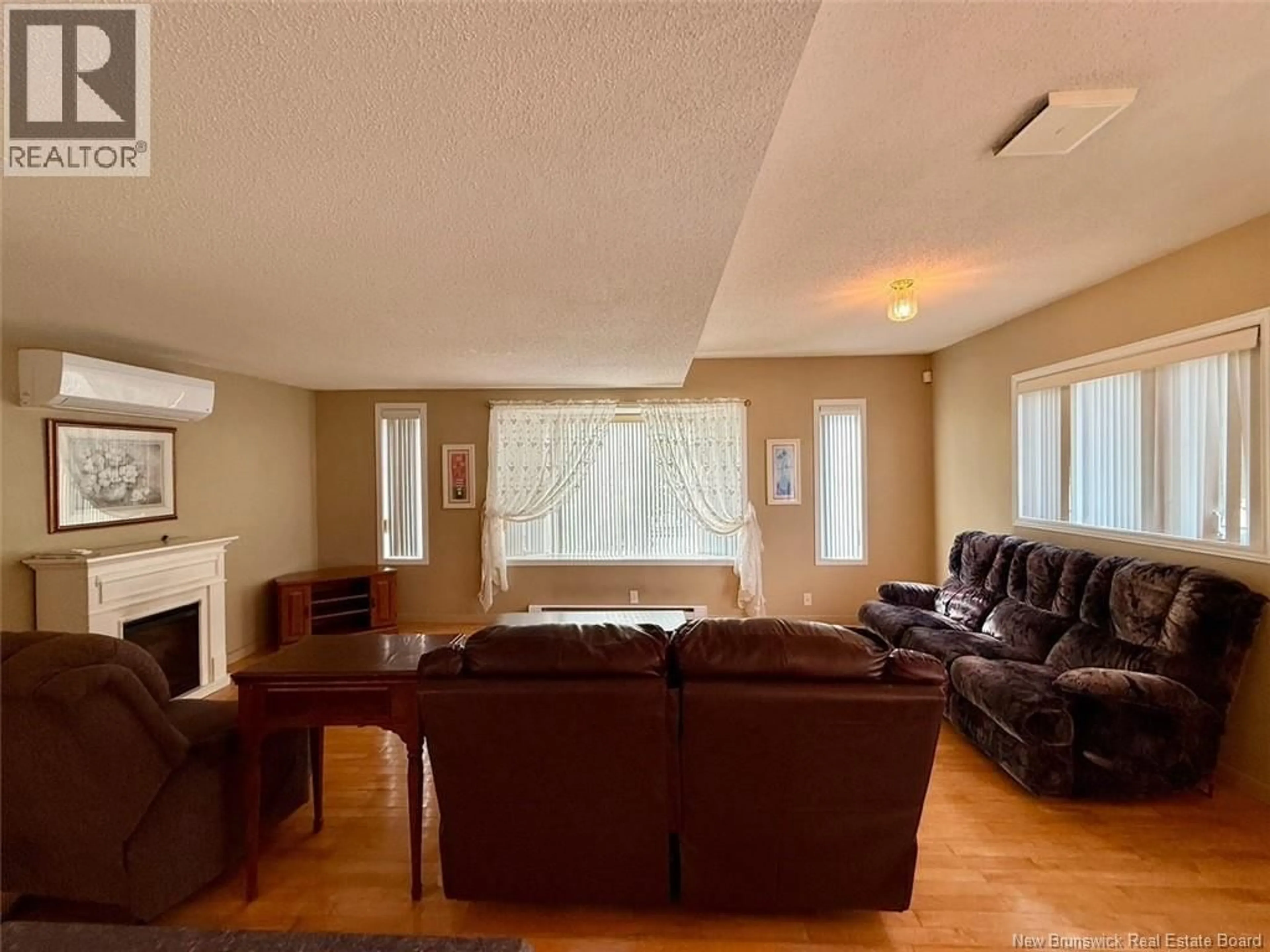Living room with furniture, wood/laminate floor for 21 MOUNTAIN VIEW PLACE, Campbellton New Brunswick E3N3K8