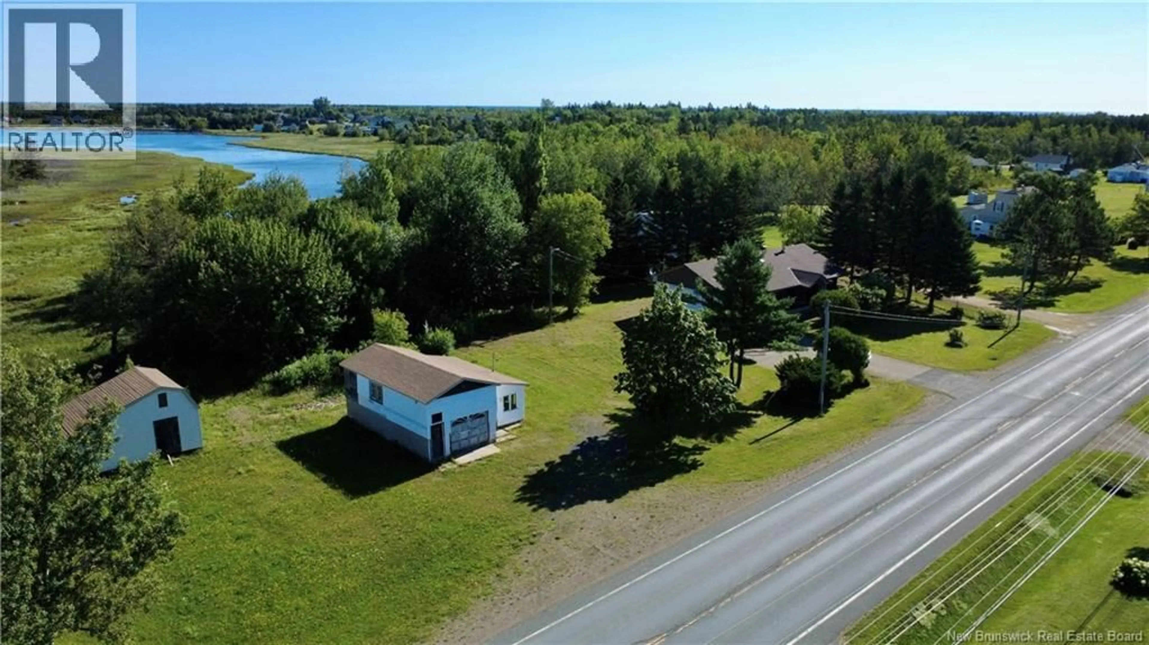 A pic from outside/outdoor area/front of a property/back of a property/a pic from drone, water/lake/river/ocean view for 263 CHEMIN VAL-COMEAU CHEMIN, Val-Comeau New Brunswick E1X1J9
