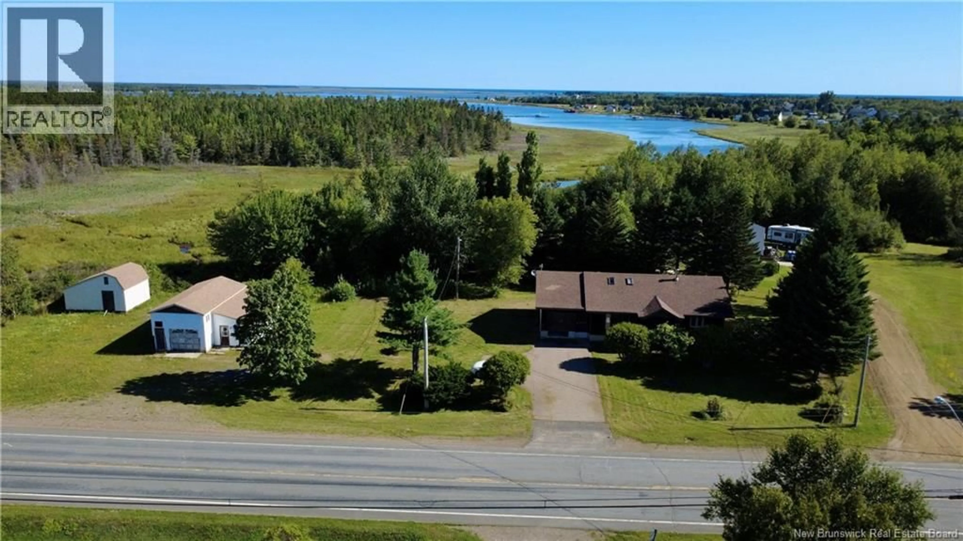 A pic from outside/outdoor area/front of a property/back of a property/a pic from drone, water/lake/river/ocean view for 263 CHEMIN VAL-COMEAU CHEMIN, Val-Comeau New Brunswick E1X1J9