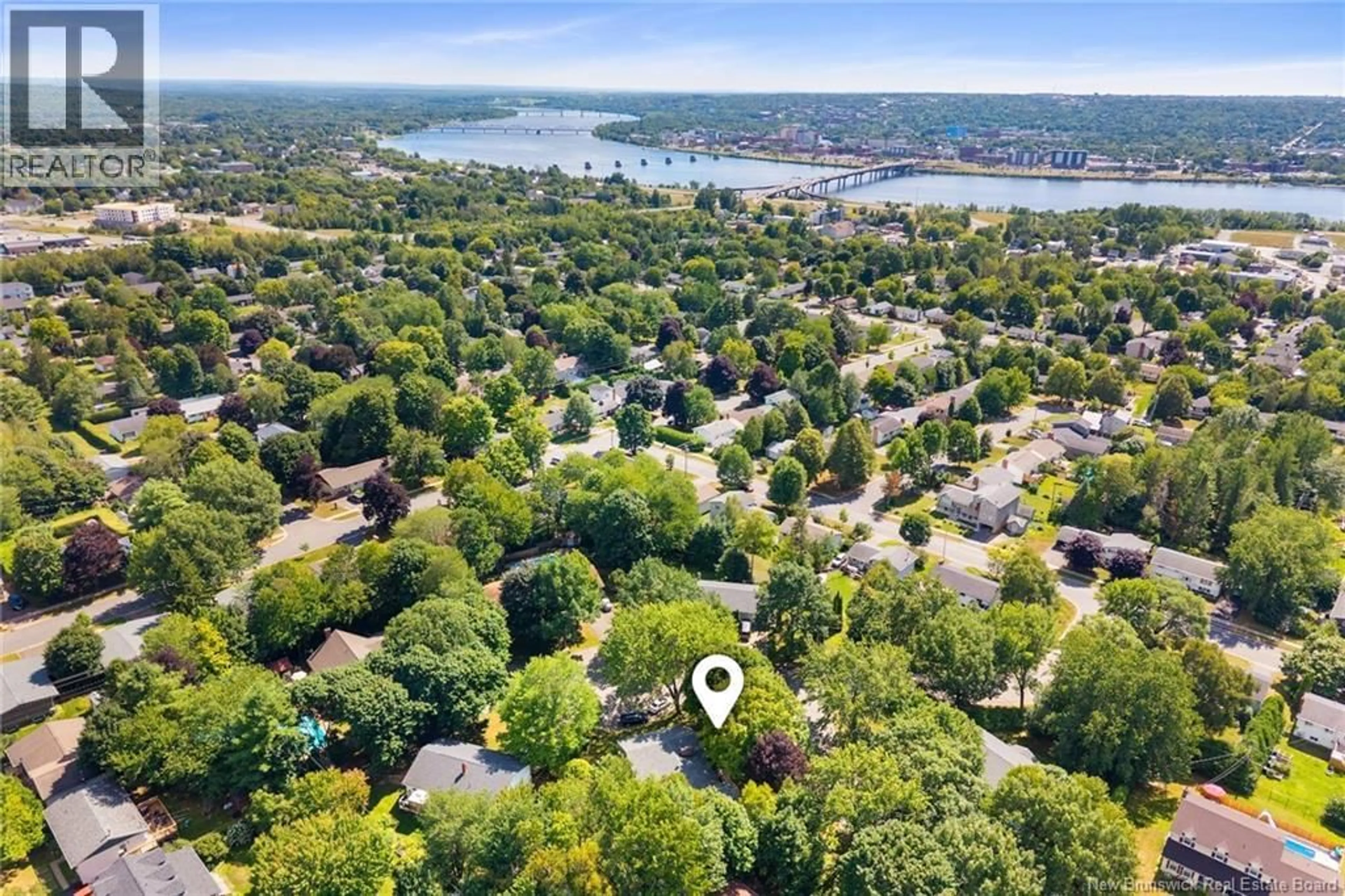 A pic from outside/outdoor area/front of a property/back of a property/a pic from drone, water/lake/river/ocean view for 4 MULBERRY COURT, Fredericton New Brunswick E3A5J1