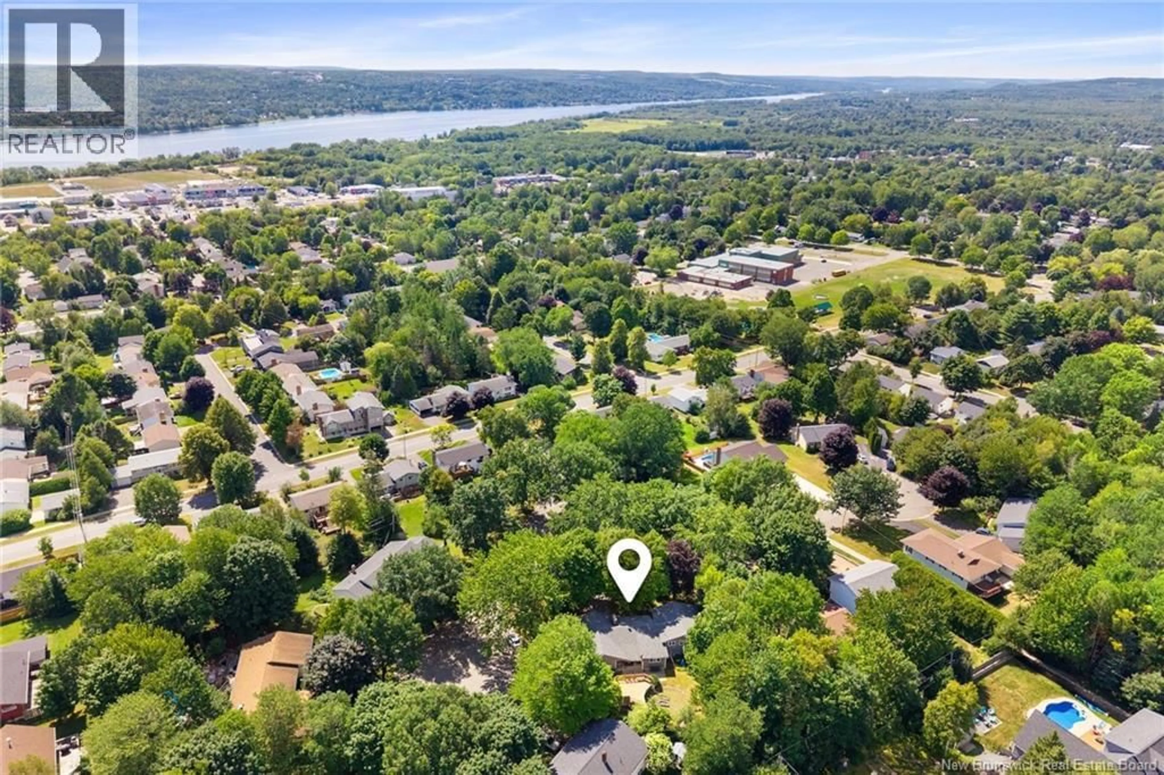 A pic from outside/outdoor area/front of a property/back of a property/a pic from drone, water/lake/river/ocean view for 4 MULBERRY COURT, Fredericton New Brunswick E3A5J1