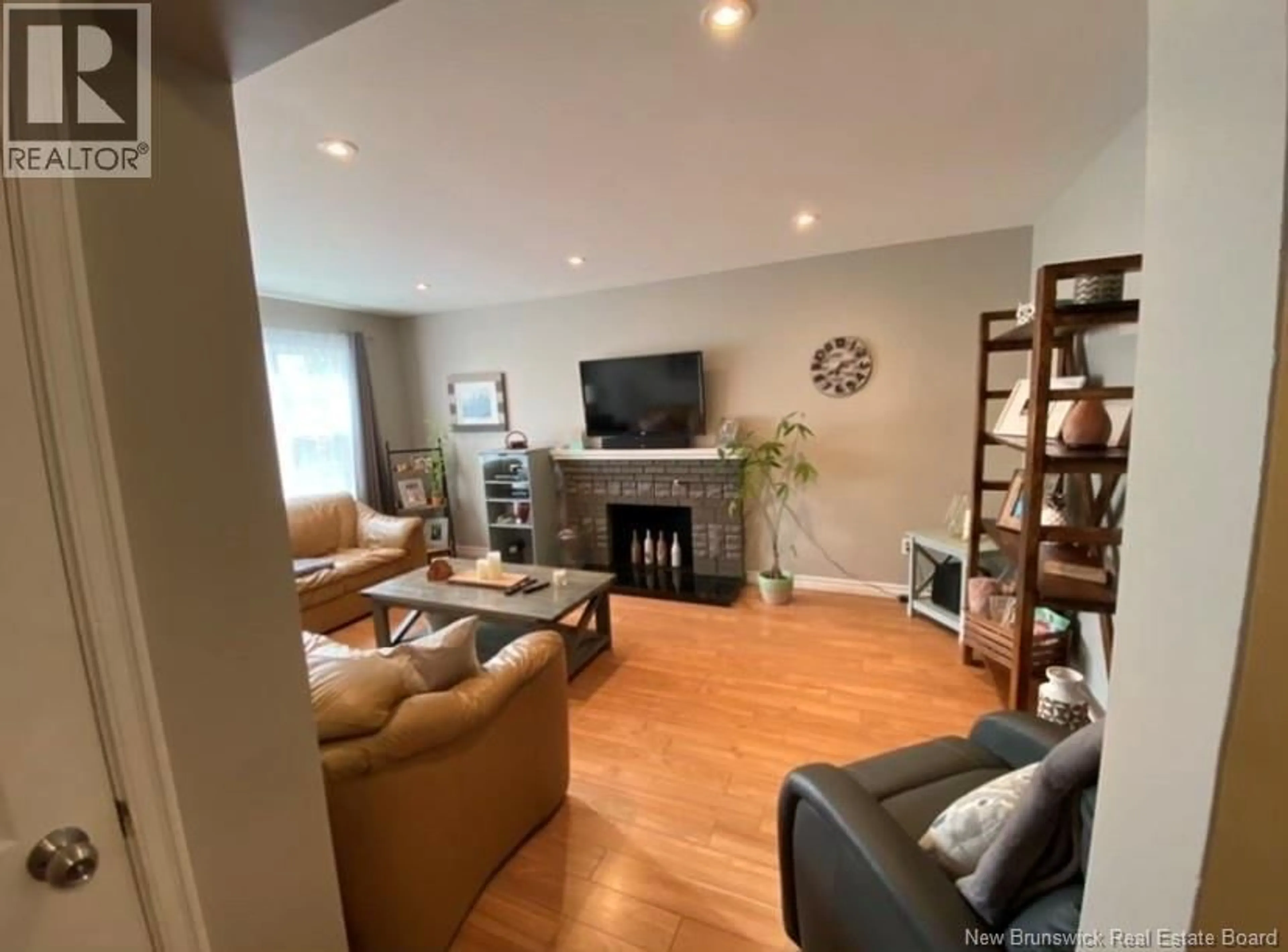 Living room with furniture, wood/laminate floor for 179 EDGETT, Moncton New Brunswick E1C7B4
