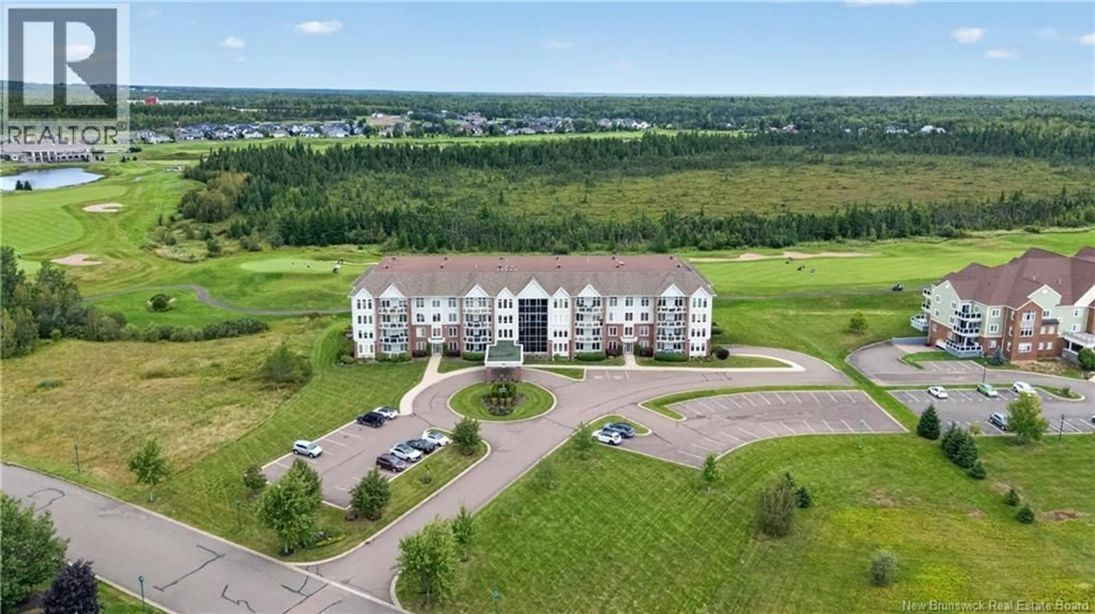 A pic from outside/outdoor area/front of a property/back of a property/a pic from drone, building for 103 - 185 ROYAL OAKS BOULEVARD, Moncton New Brunswick E1H2P7