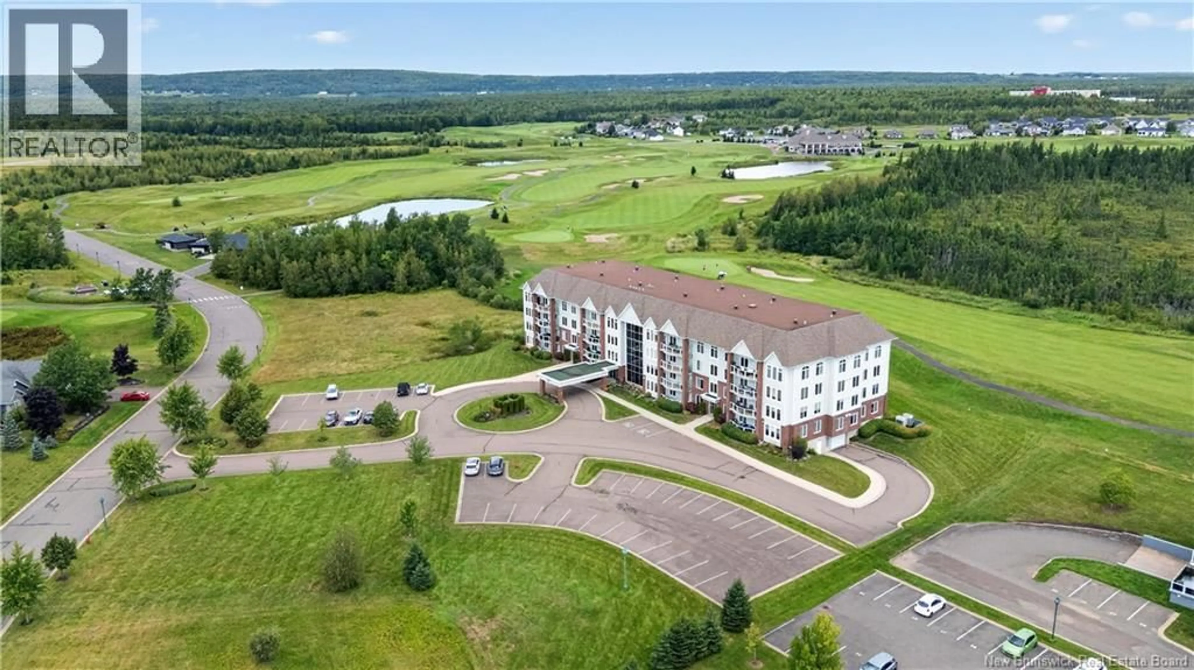 A pic from outside/outdoor area/front of a property/back of a property/a pic from drone, building for 103 - 185 ROYAL OAKS BOULEVARD, Moncton New Brunswick E1H2P7