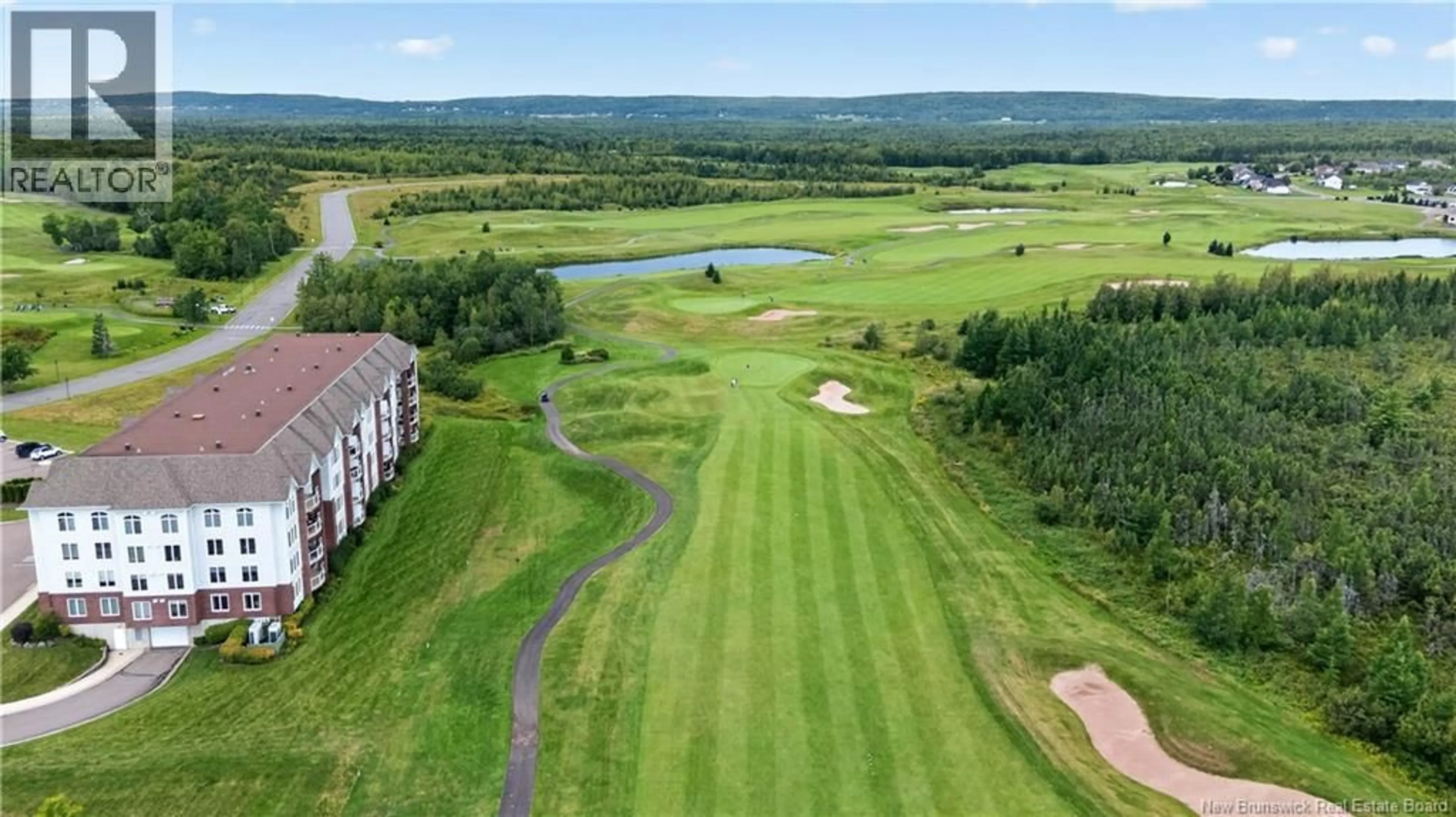 A pic from outside/outdoor area/front of a property/back of a property/a pic from drone, water/lake/river/ocean view for 103 - 185 ROYAL OAKS BOULEVARD, Moncton New Brunswick E1H2P7