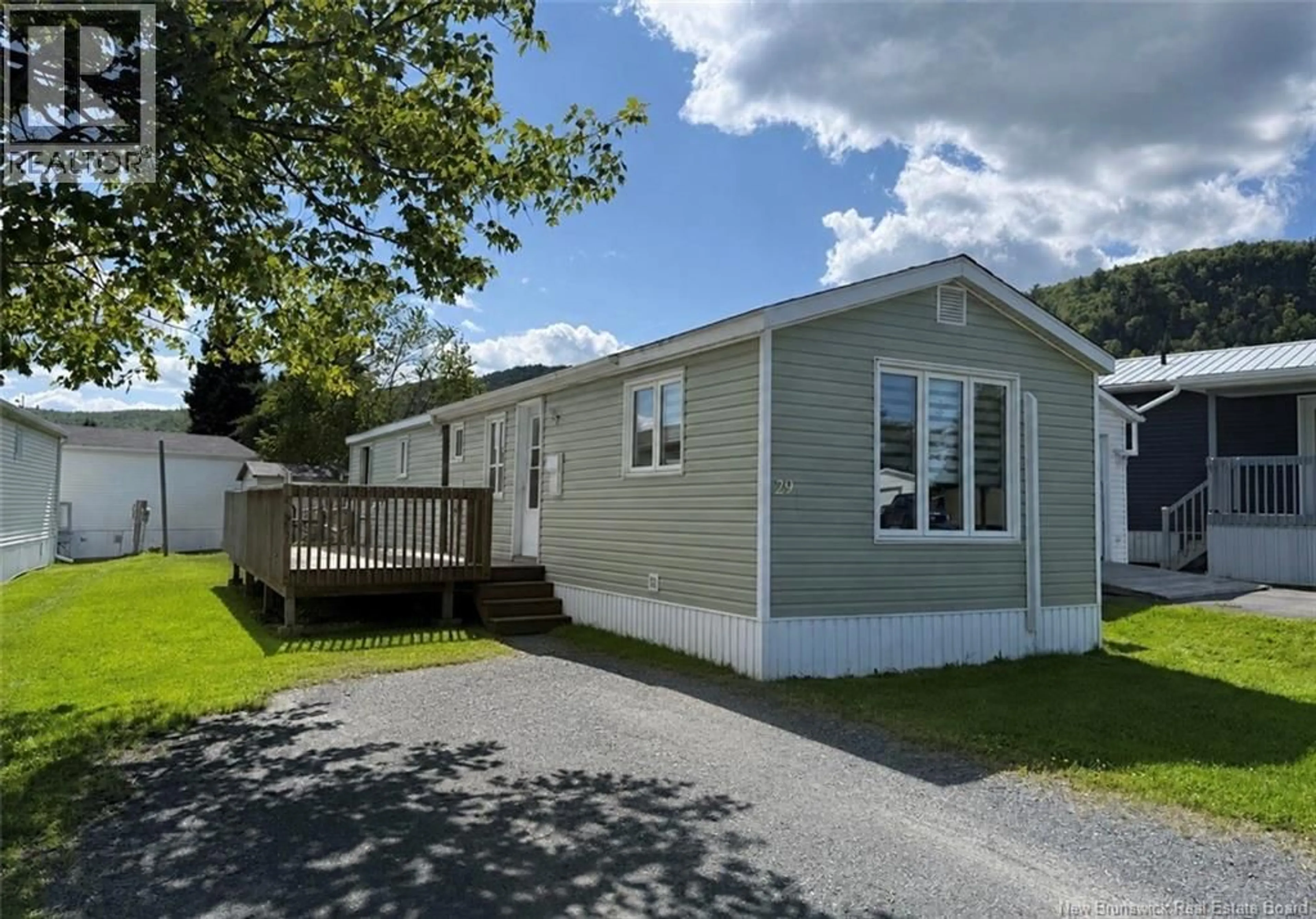 A pic from outside/outdoor area/front of a property/back of a property/a pic from drone, street for 29 PARC P'TISO STREET, Edmundston New Brunswick E3V3X7