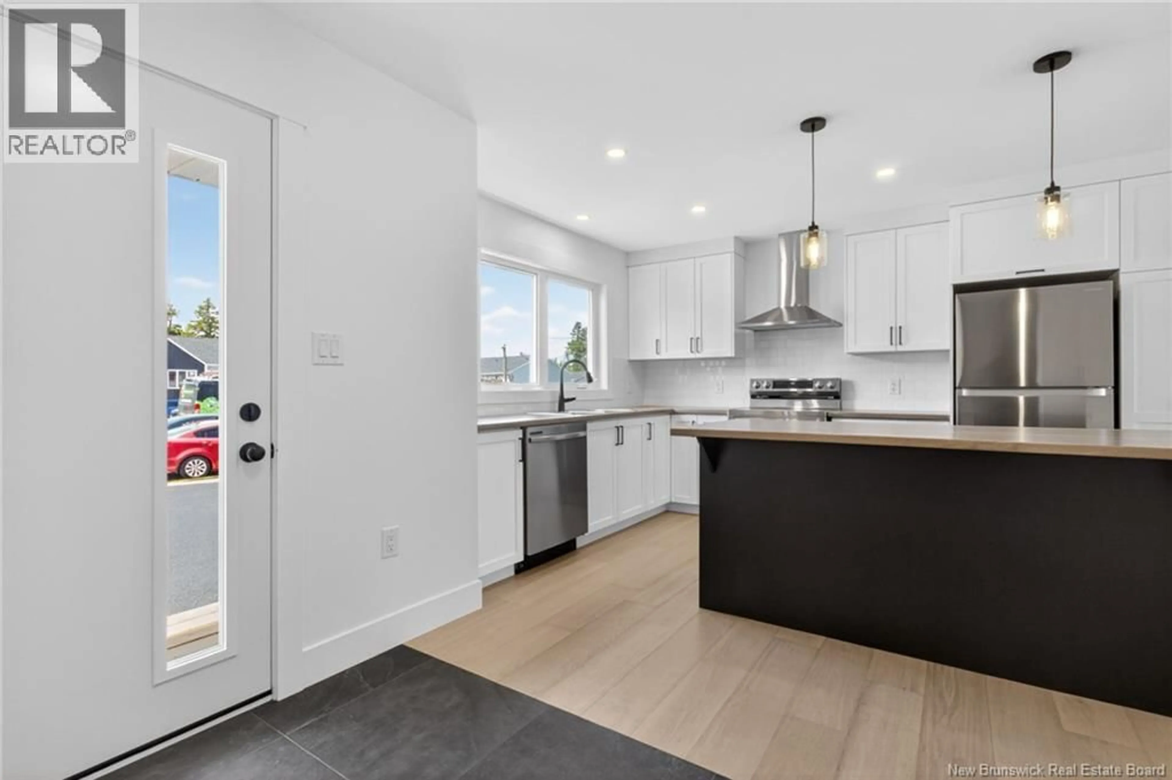 Open concept kitchen, ceramic/tile floor for 20 CEDRIC COURT, Dieppe New Brunswick E1K0A5