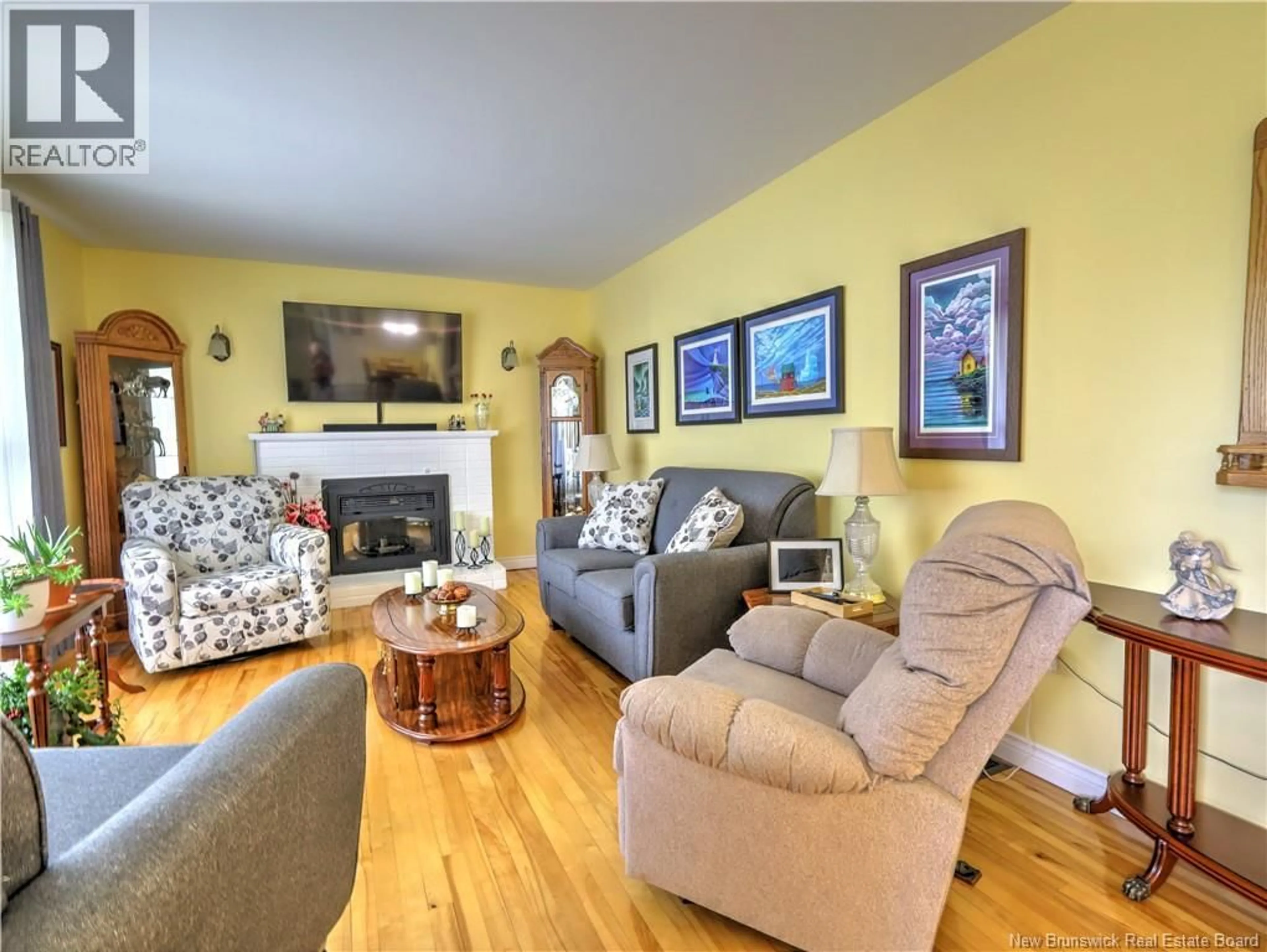 Living room with furniture, wood/laminate floor for 335 MACDONALD AVENUE, Oromocto New Brunswick E2V1A8