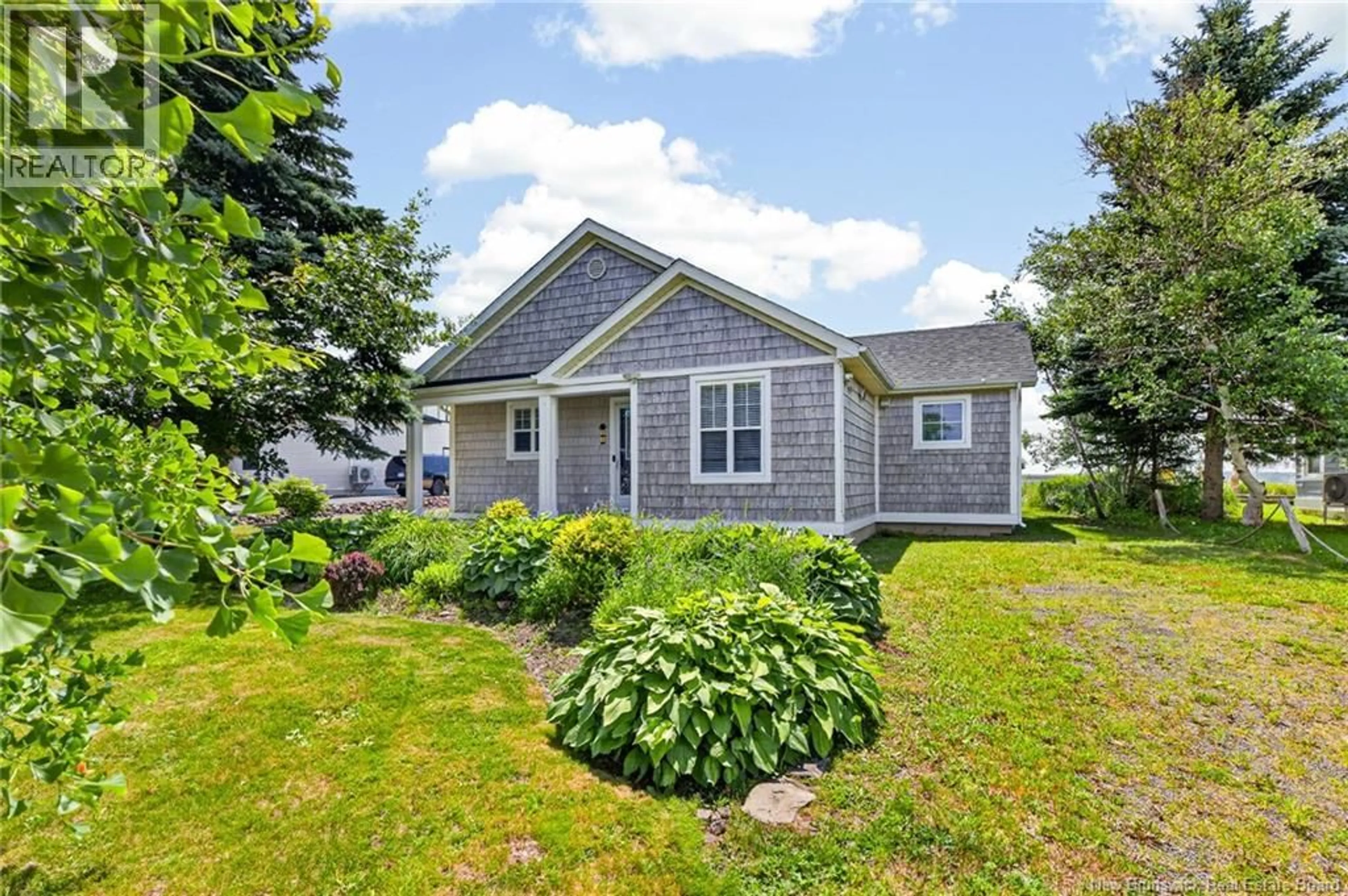 Home with vinyl exterior material, street for 54 ACADIE STREET, Cocagne New Brunswick E4R5Y6