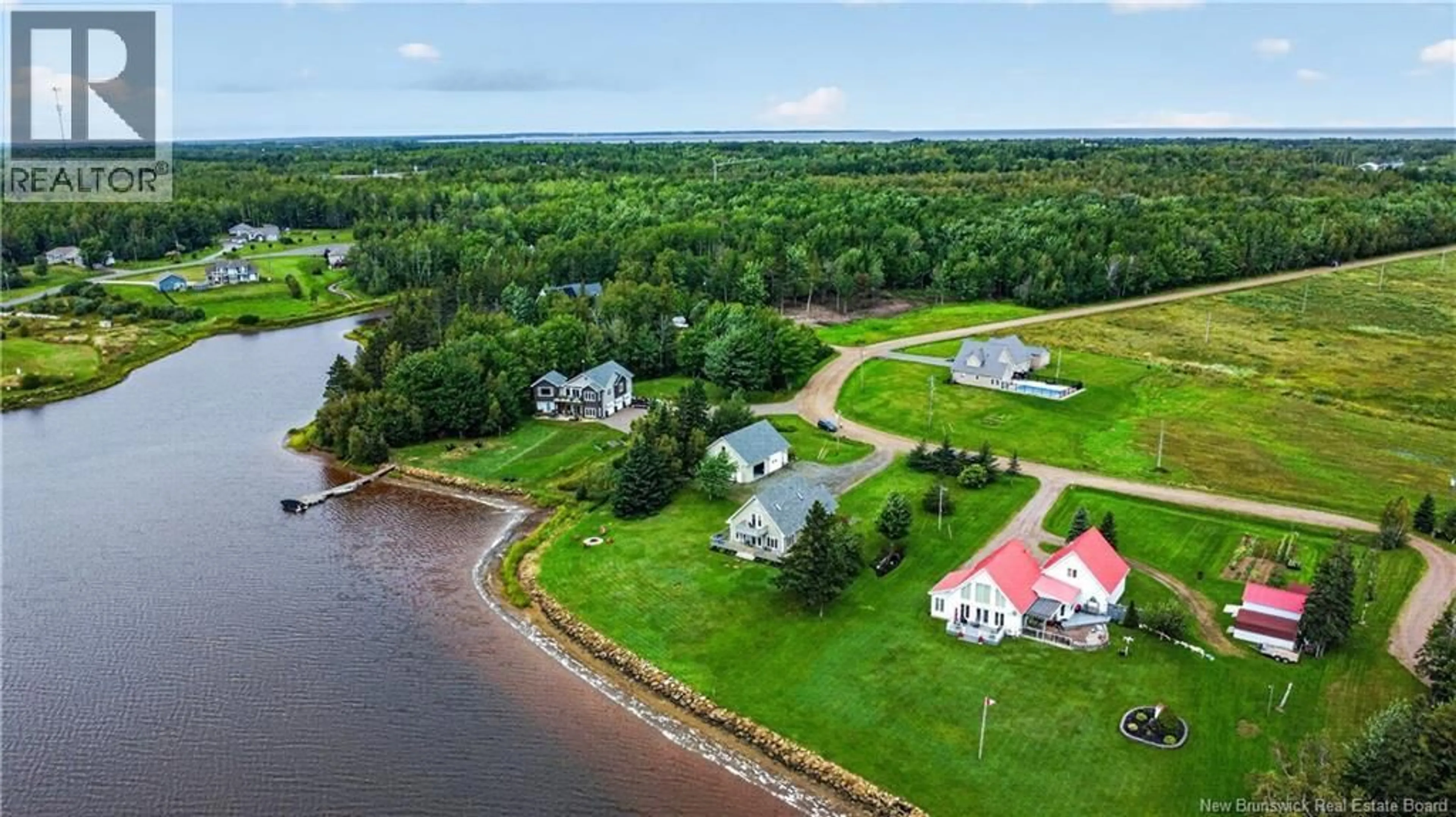 A pic from outside/outdoor area/front of a property/back of a property/a pic from drone, water/lake/river/ocean view for 53 CHEMIN DE LA RIVIERE, Grand-Barachois New Brunswick E4P7E4
