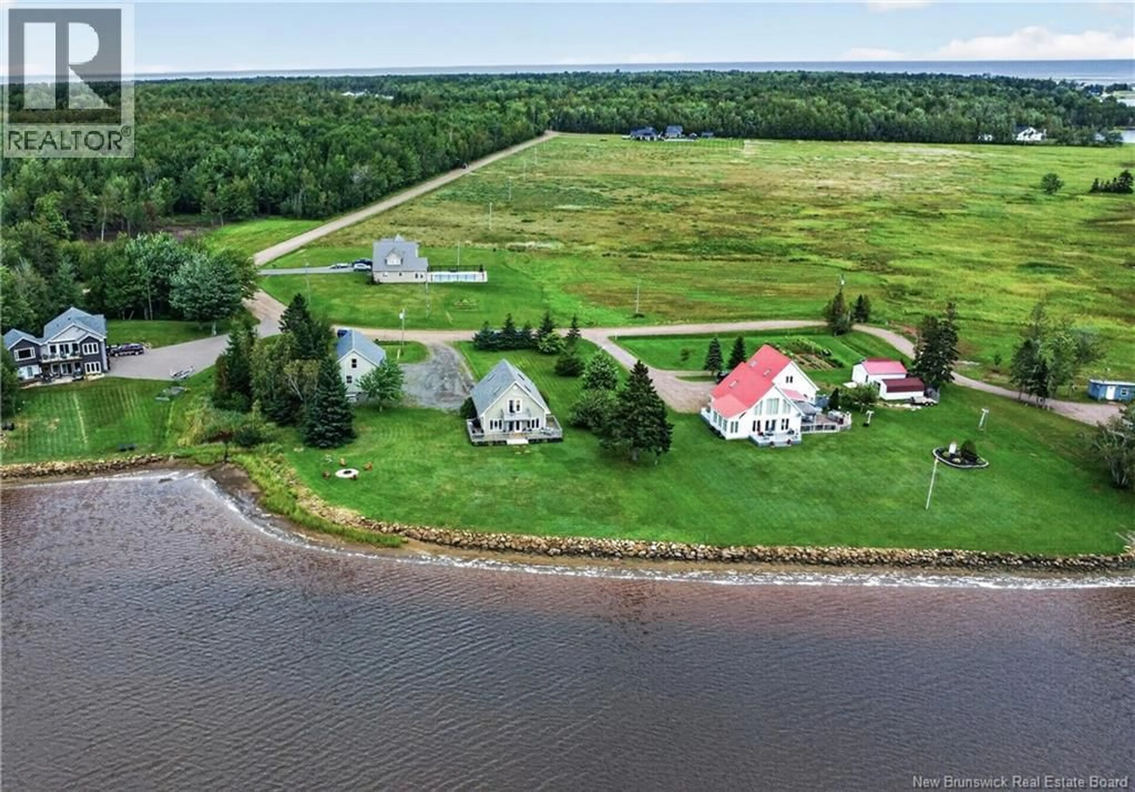 A pic from outside/outdoor area/front of a property/back of a property/a pic from drone, water/lake/river/ocean view for 53 CHEMIN DE LA RIVIERE, Grand-Barachois New Brunswick E4P7E4