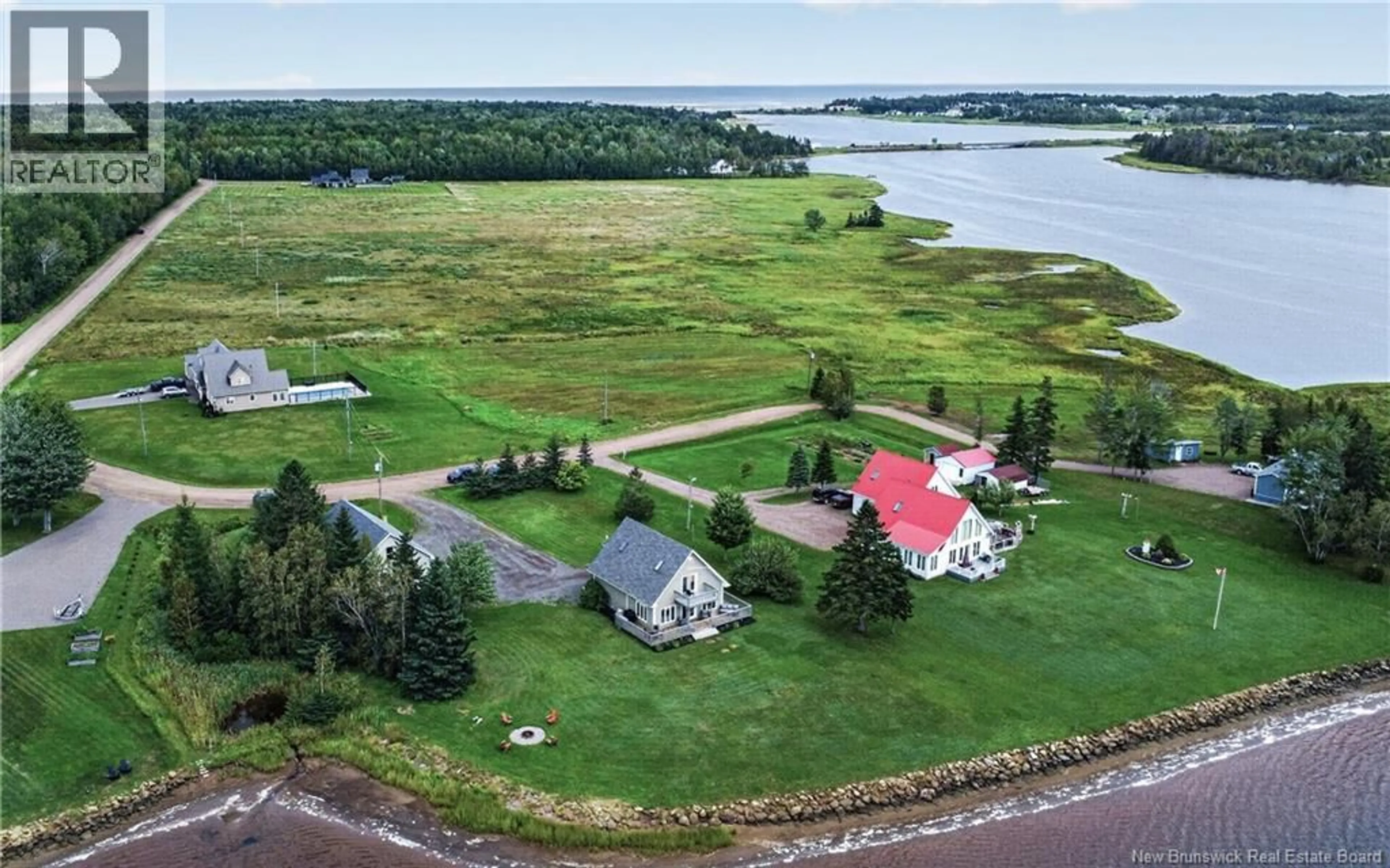 A pic from outside/outdoor area/front of a property/back of a property/a pic from drone, water/lake/river/ocean view for 53 CHEMIN DE LA RIVIERE, Grand-Barachois New Brunswick E4P7E4