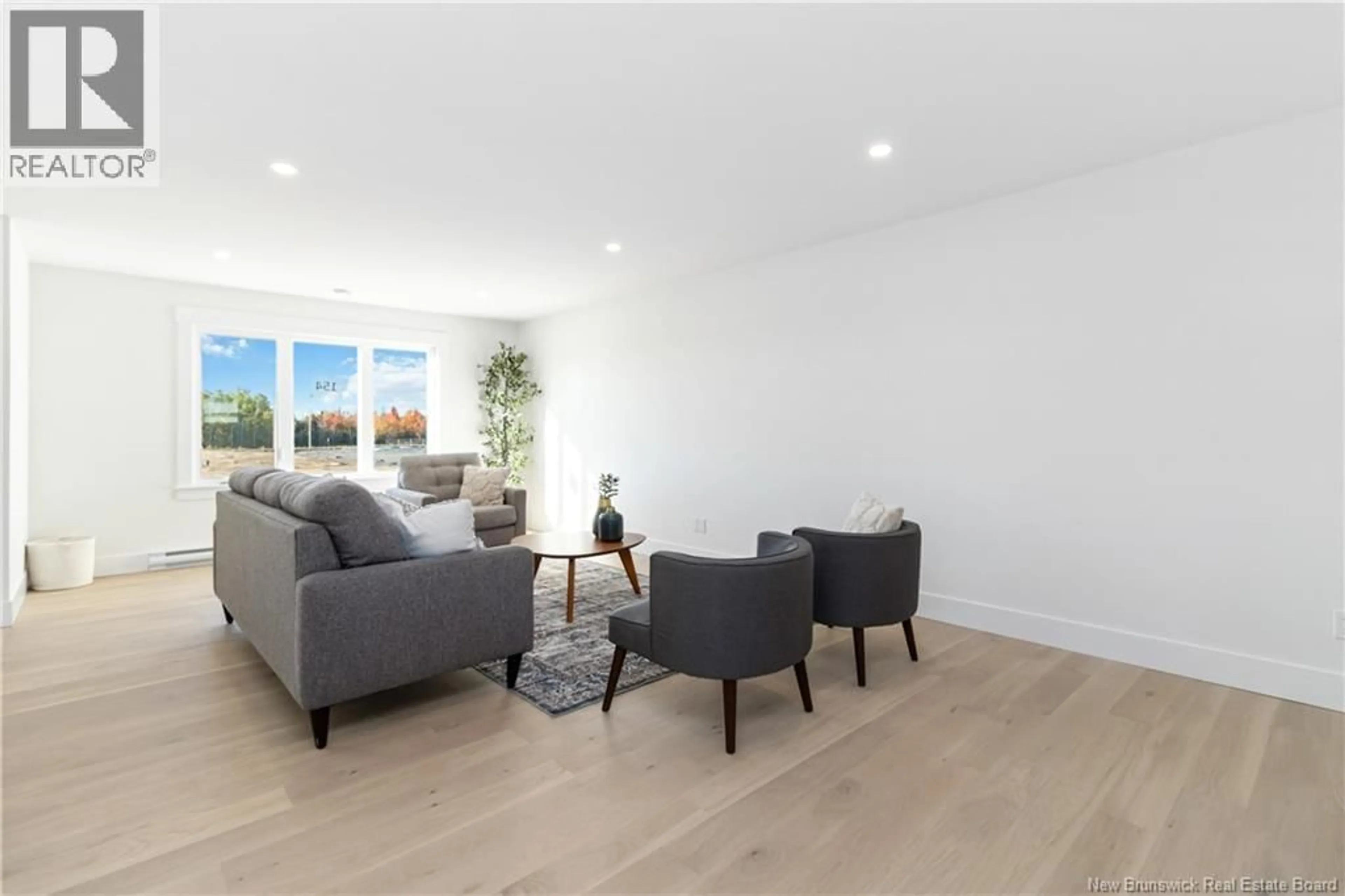 Living room with furniture, wood/laminate floor for 126 WHITEROCKS DRIVE, Riverview New Brunswick E1B0Y1