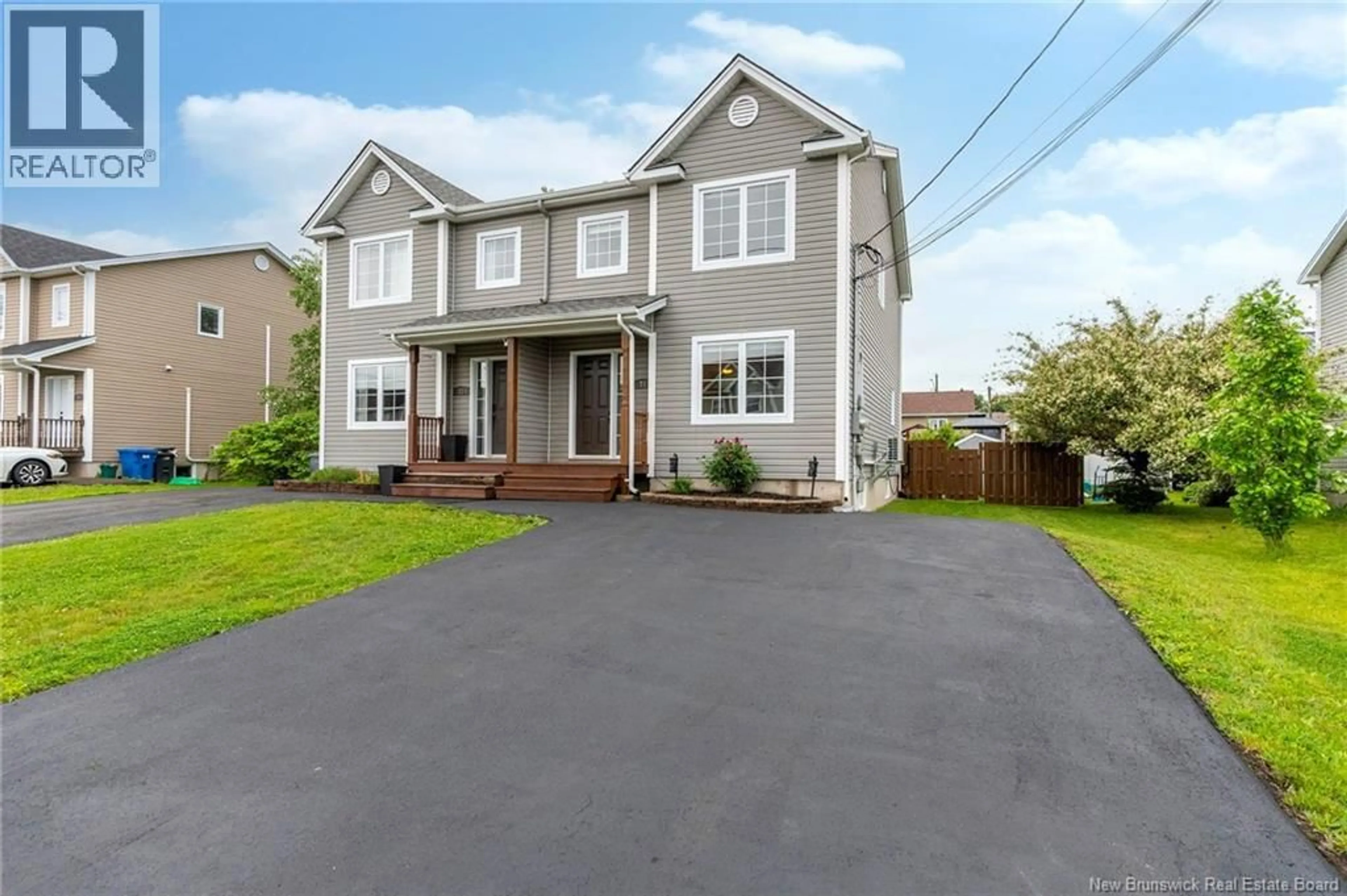 Home with vinyl exterior material, street for 71 HOULAHAN STREET, Dieppe New Brunswick E1A0S9