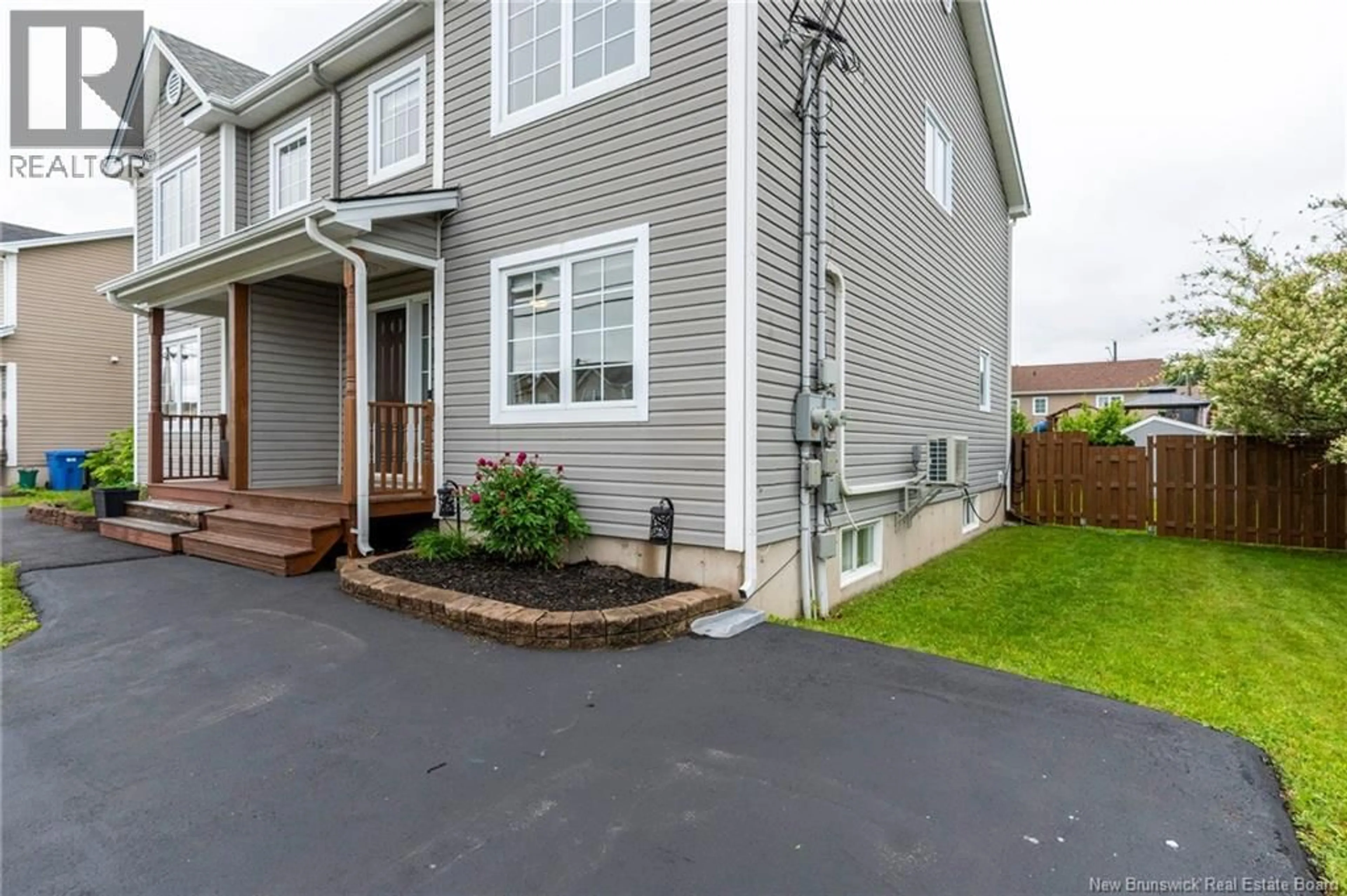 Home with vinyl exterior material, street for 71 HOULAHAN STREET, Dieppe New Brunswick E1A0S9